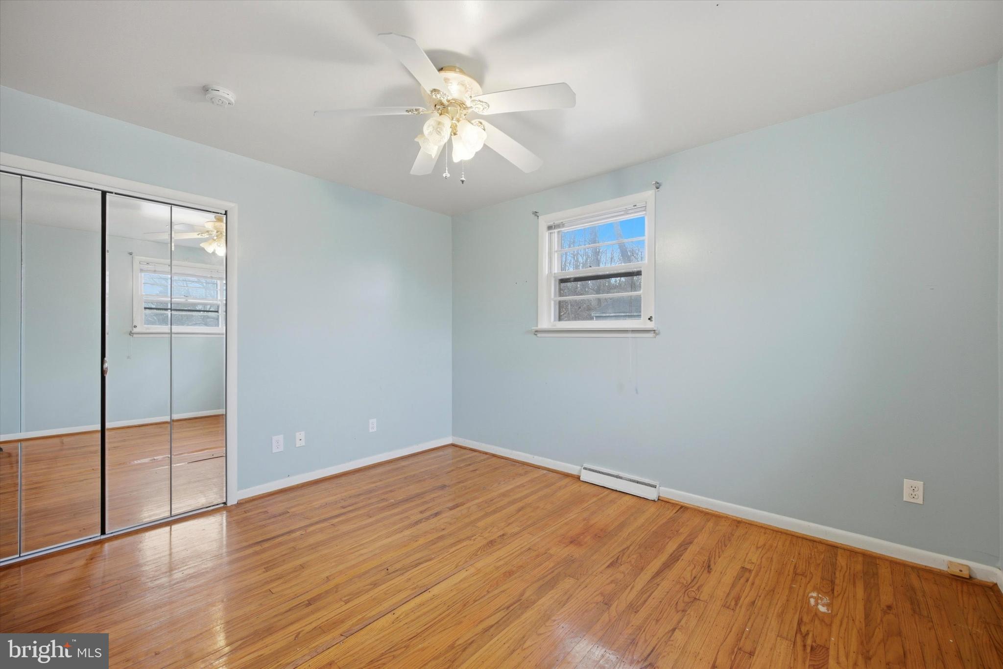 129 Locksley Road Glen Mills, PA 19342 - Photo 18 of 36 wooden floor in an empty room with a window