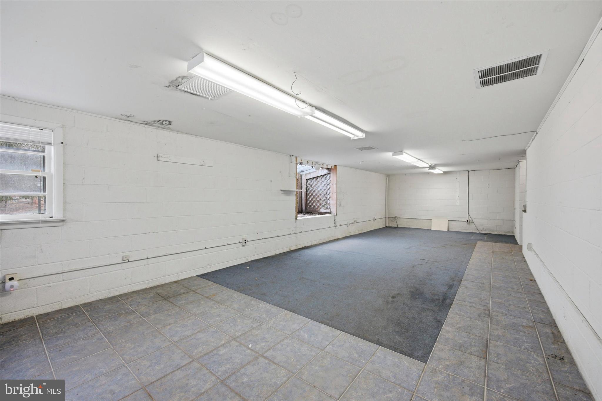129 Locksley Road Glen Mills, PA 19342 - Photo 21 of 36 Finished portion of basement with atrium