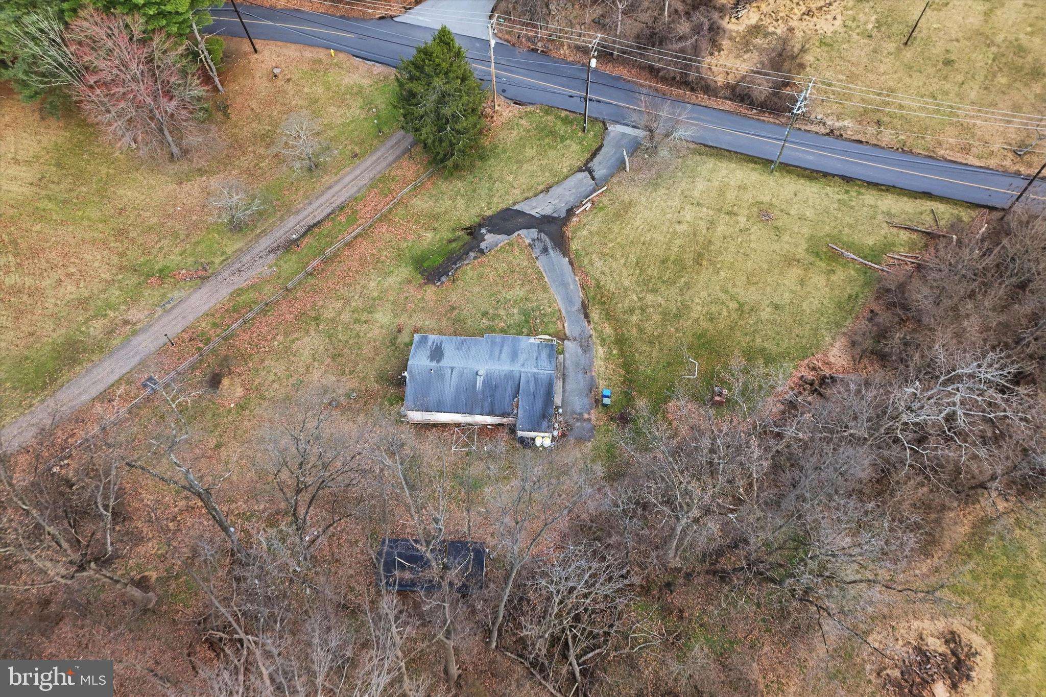 129 Locksley Road Glen Mills, PA 19342 - Photo 35 of 36 a view of a pool in a backyard