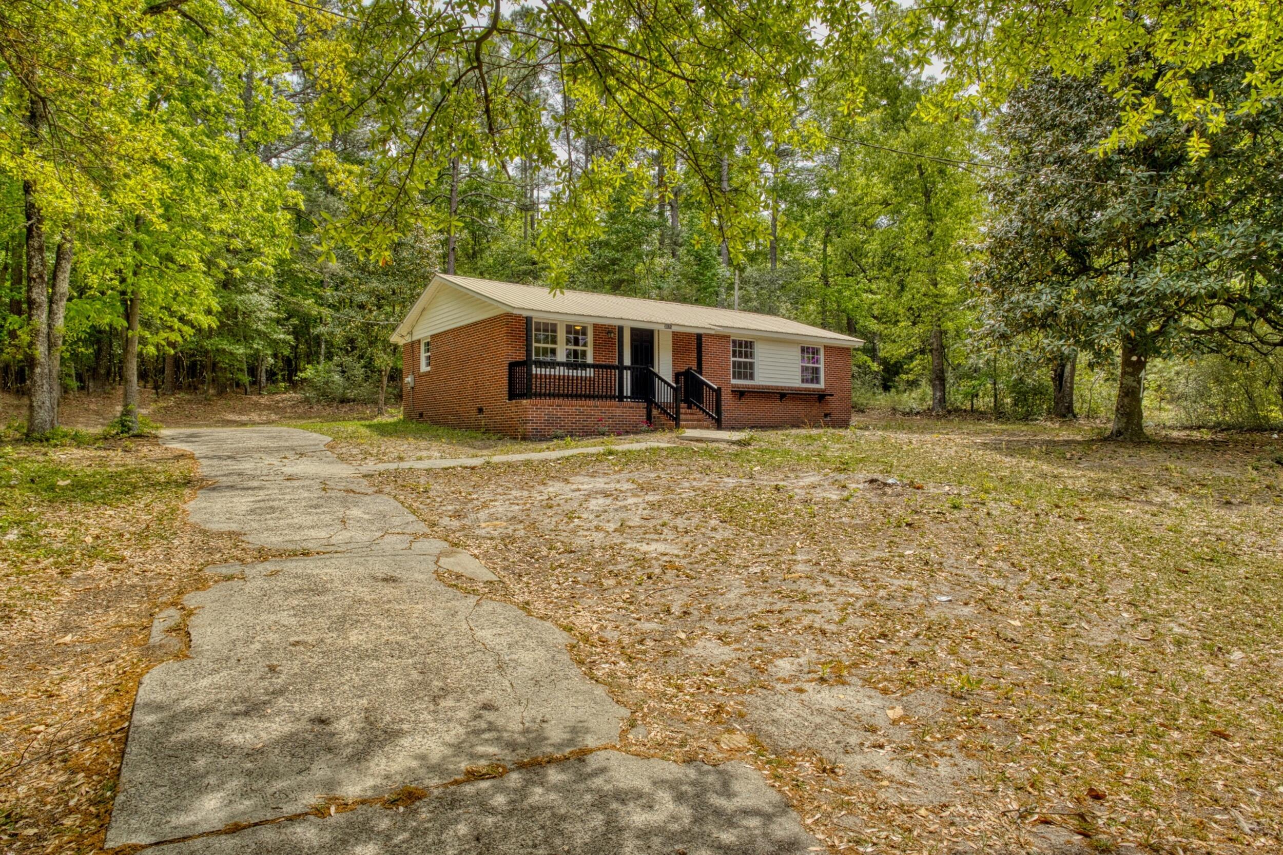 3016 Wagener Road Aiken, SC 29801 - Photo 3 of 29 a house with trees in front of it