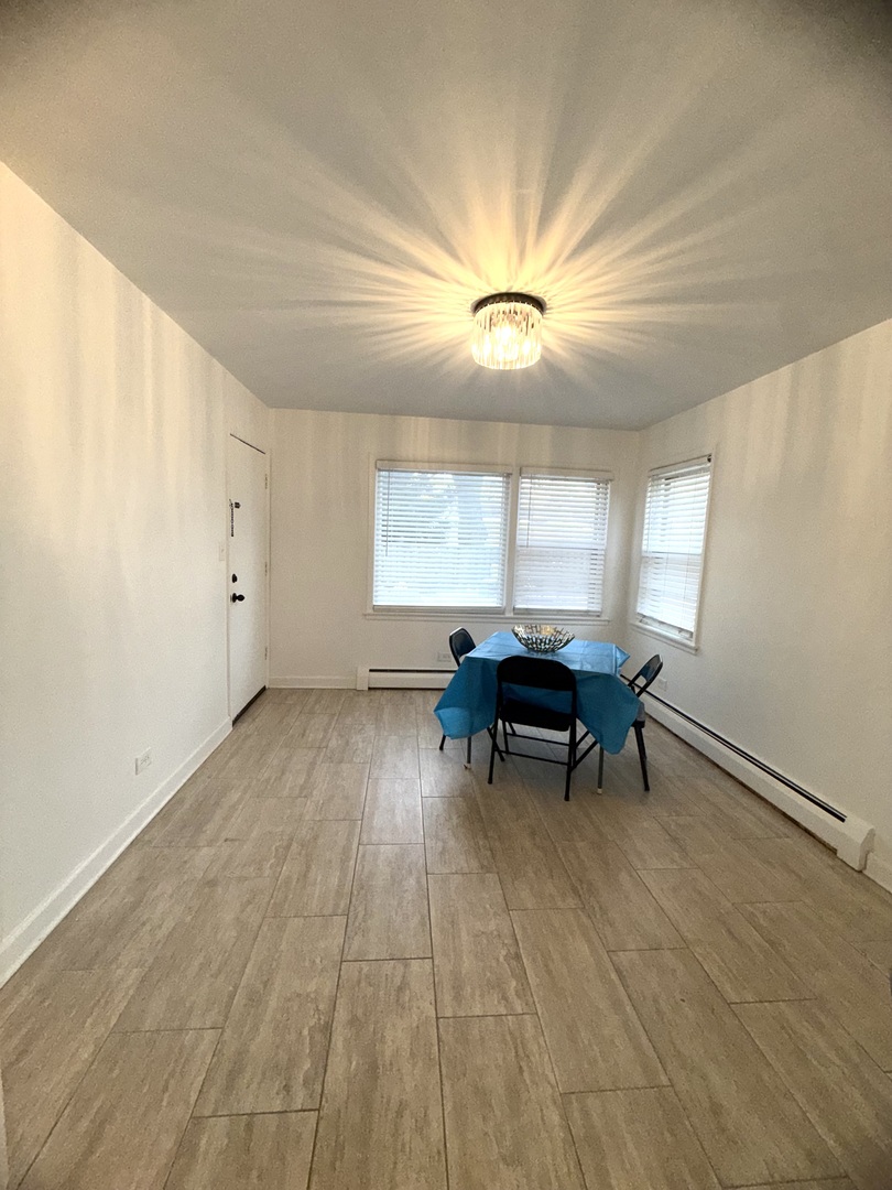 2308 Oakton Street, Unit 1 Park Ridge, IL 60068 - Photo 4 of 8 wooden floor in a room with a window