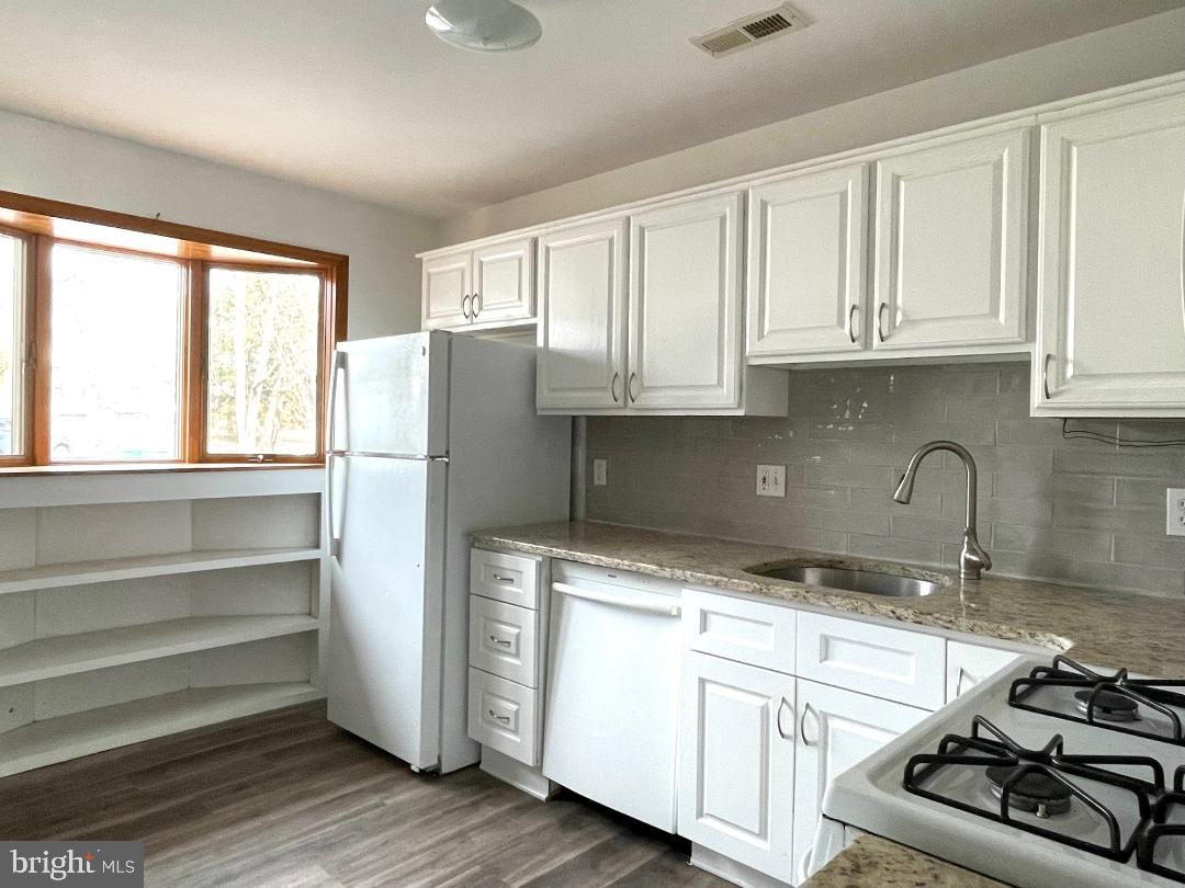904-906 Main Avenue Croydon, PA 19021 - Photo 9 of 51 a kitchen with appliances cabinets and a sink