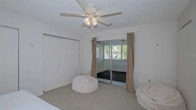 a bathroom with a toilet a sink and view