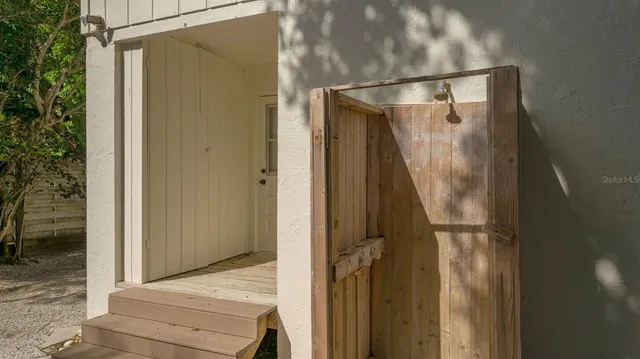 a bathroom with a glass shower door