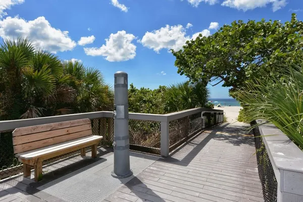a view of a balcony with wooden floor