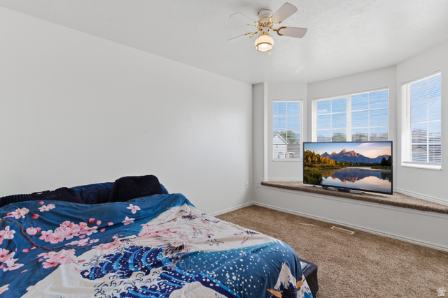 134 West 475 South Ogden, UT 84404 - Photo 15 of 27 Bedroom featuring carpet flooring and a ceiling fan