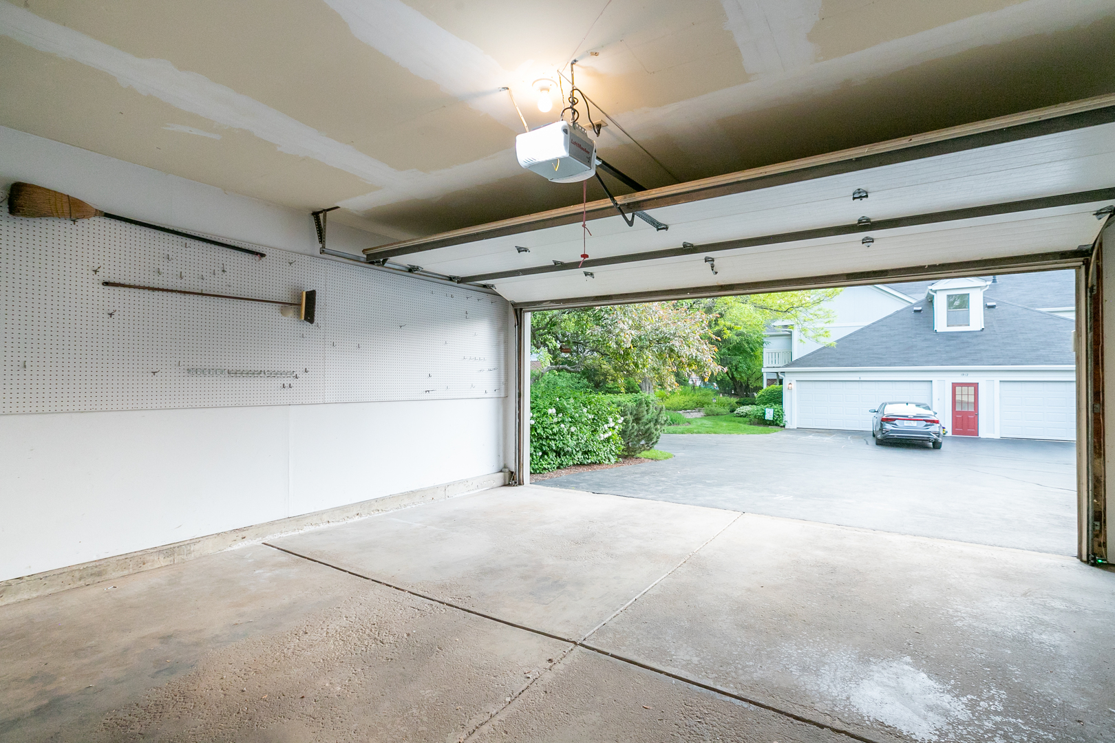 1900 Gresham Circle, Unit B Wheaton, IL 60189 - Photo 15 of 19 a view of a room with a ceiling fan and window