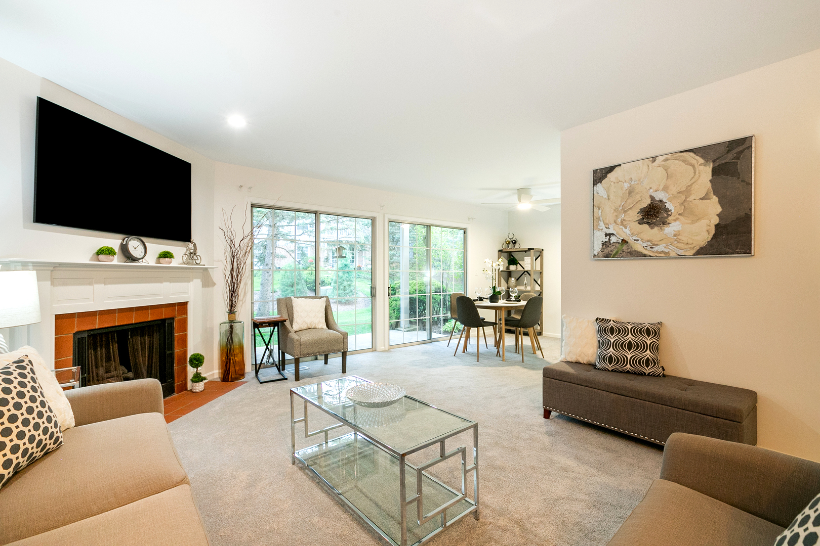 1900 Gresham Circle, Unit B Wheaton, IL 60189 - Photo 3 of 19 a living room with furniture a flat screen tv and a fireplace