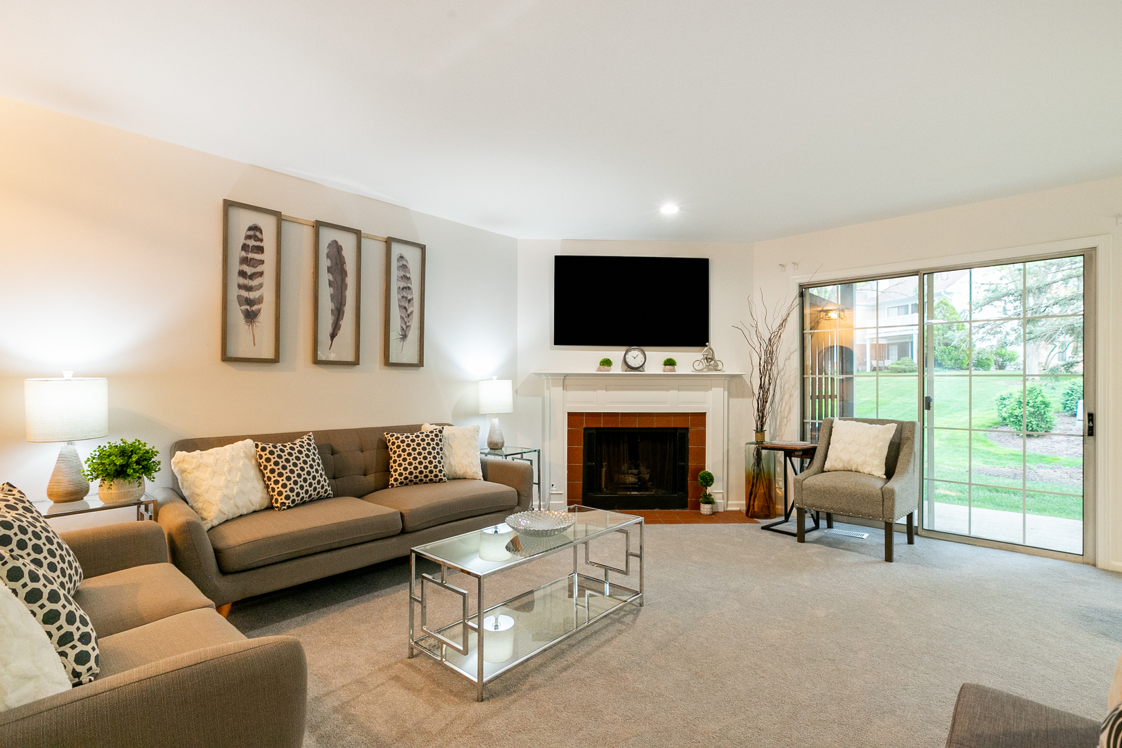 1900 Gresham Circle, Unit B Wheaton, IL 60189 - Photo 4 of 19 a living room with furniture a flat screen tv and a fireplace