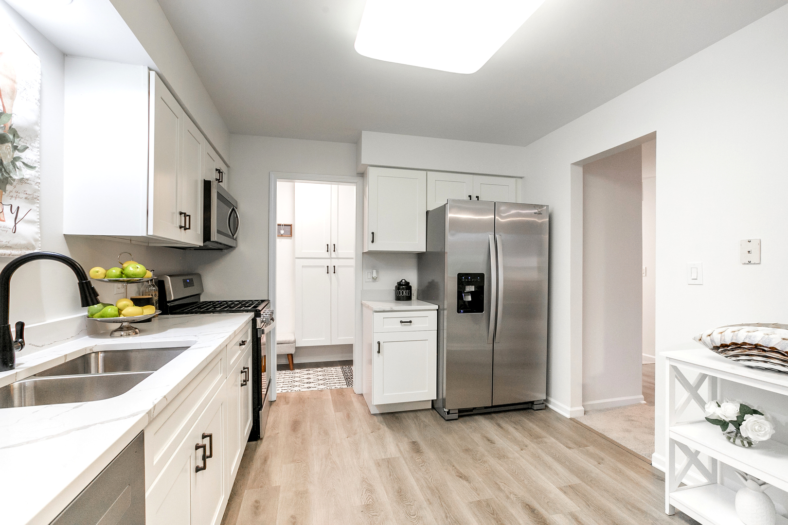 1900 Gresham Circle, Unit B Wheaton, IL 60189 - Photo 8 of 19 a kitchen with a refrigerator sink and stove