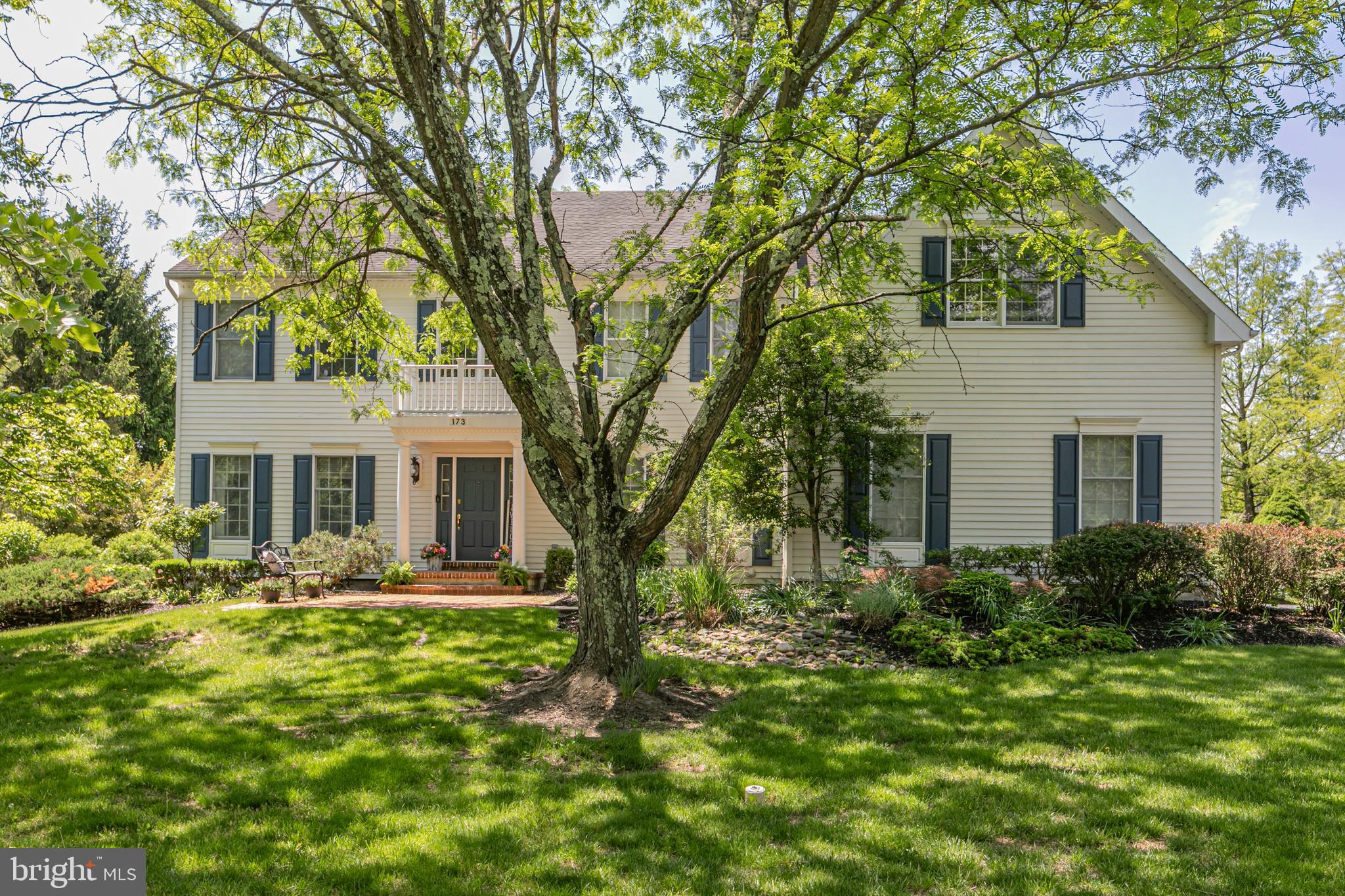 173 Christopher Drive Princeton, NJ 08540 - Photo 2 of 61 a front view of a house with garden and trees
