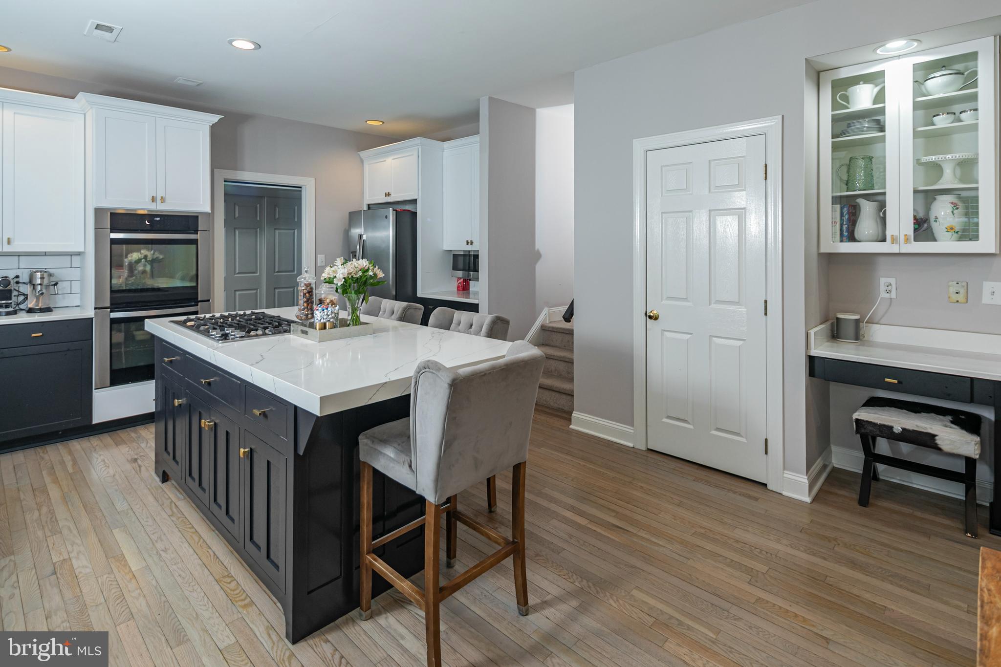 173 Christopher Drive Princeton, NJ 08540 - Photo 24 of 61 a open kitchen with kitchen island a stove a sink a refrigerator dining table and chairs