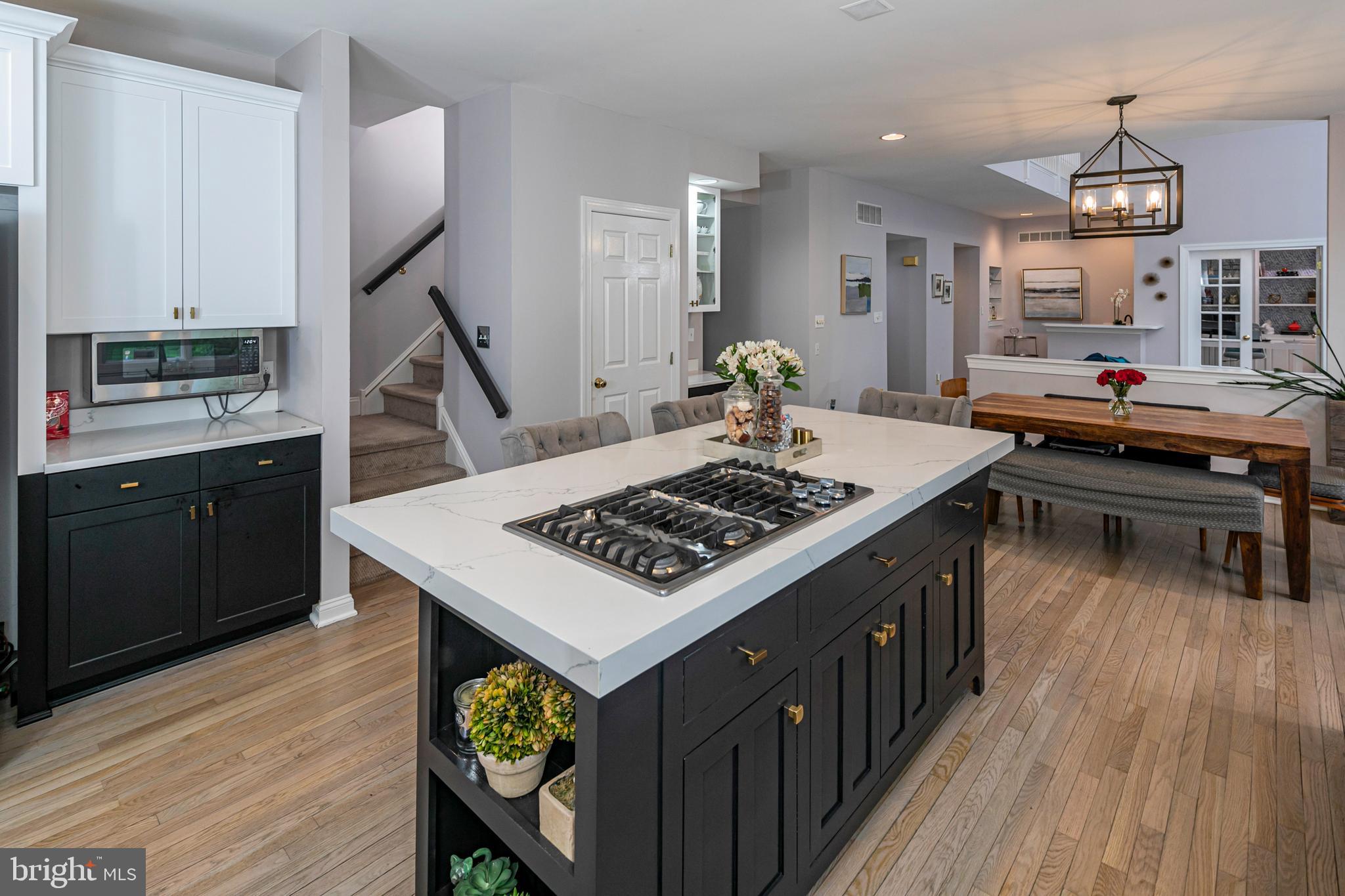 173 Christopher Drive Princeton, NJ 08540 - Photo 26 of 61 a kitchen that has a stove and a wooden floor