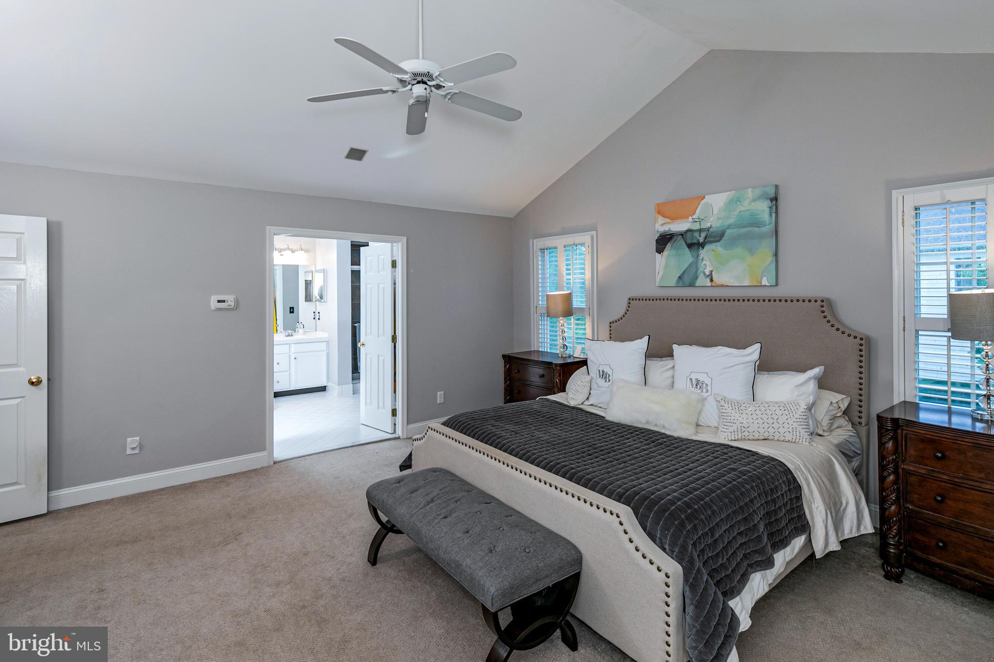 173 Christopher Drive Princeton, NJ 08540 - Photo 30 of 61 a spacious bedroom with a bed and a chandelier