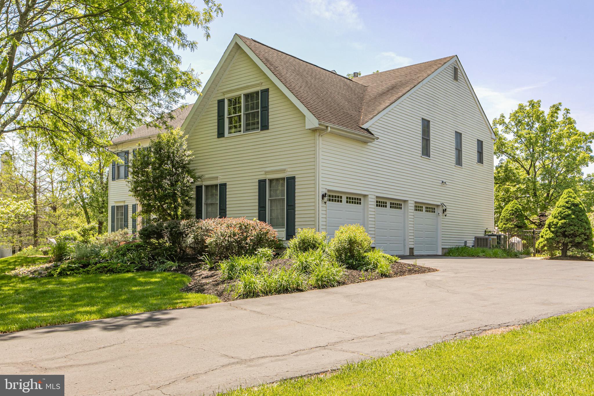 173 Christopher Drive Princeton, NJ 08540 - Photo 51 of 61 a front view of a house with a yard and a garage