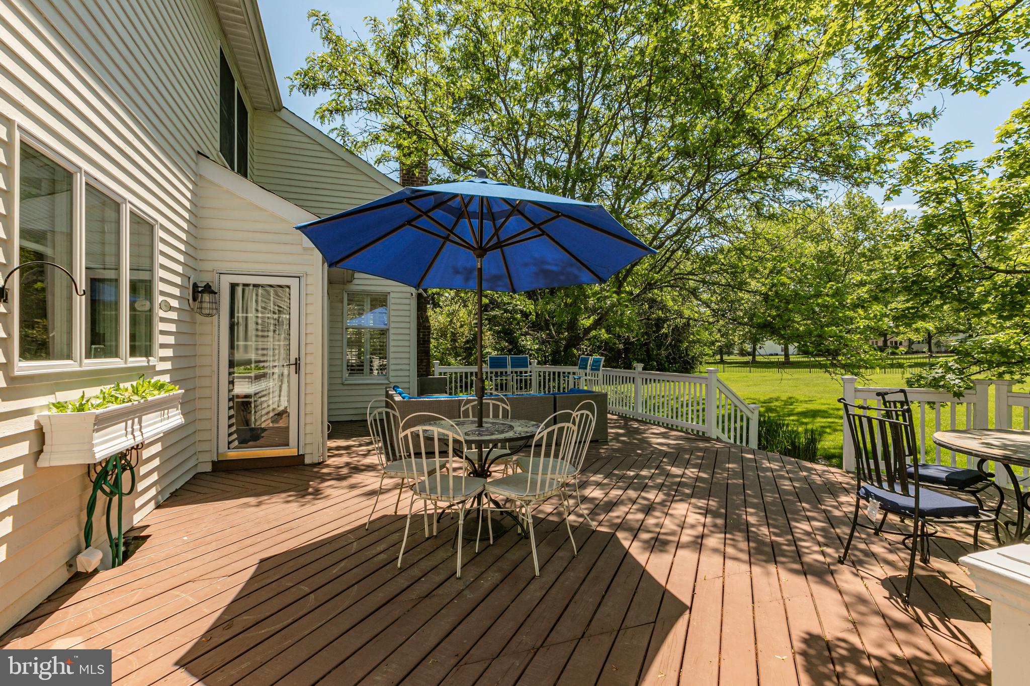 173 Christopher Drive Princeton, NJ 08540 - Photo 53 of 61 a view of a patio with chairs under an umbrella