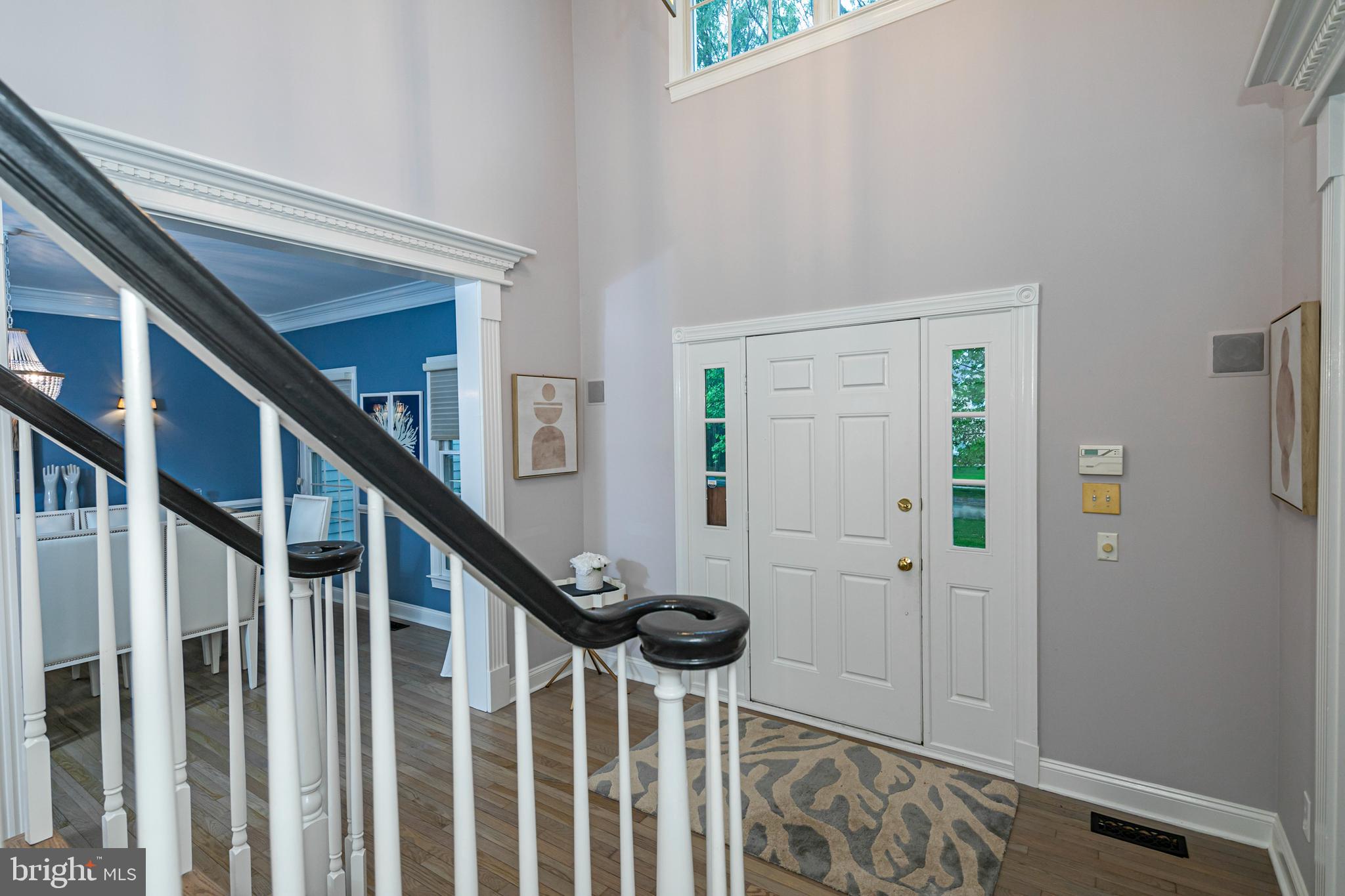 173 Christopher Drive Princeton, NJ 08540 - Photo 6 of 61 a view of entryway with wooden floor and stairs