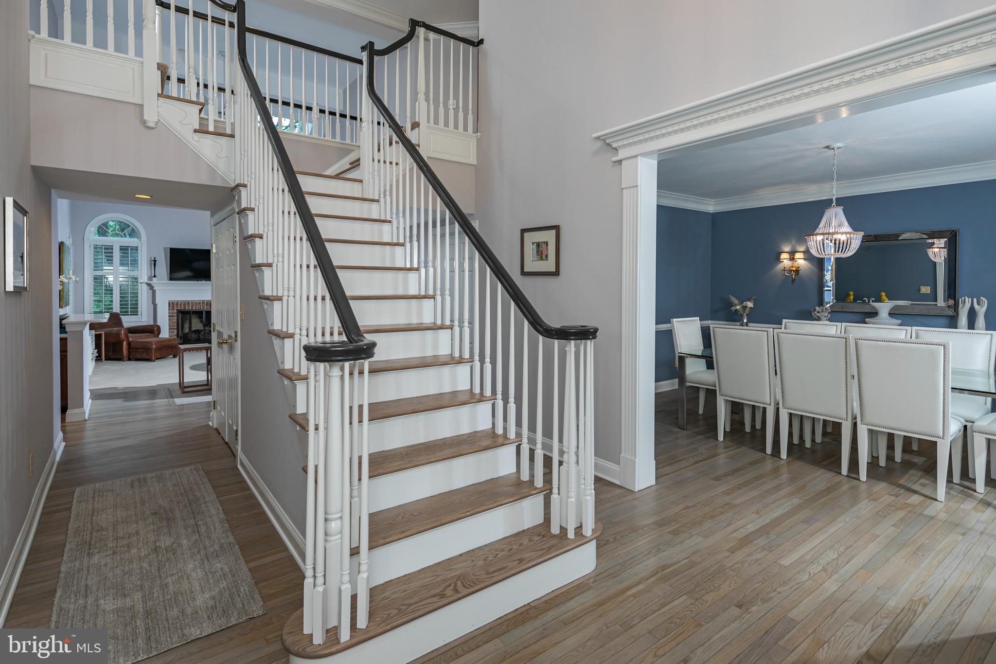 173 Christopher Drive Princeton, NJ 08540 - Photo 8 of 61 a view of a hallway with wooden floor staircase and living room view