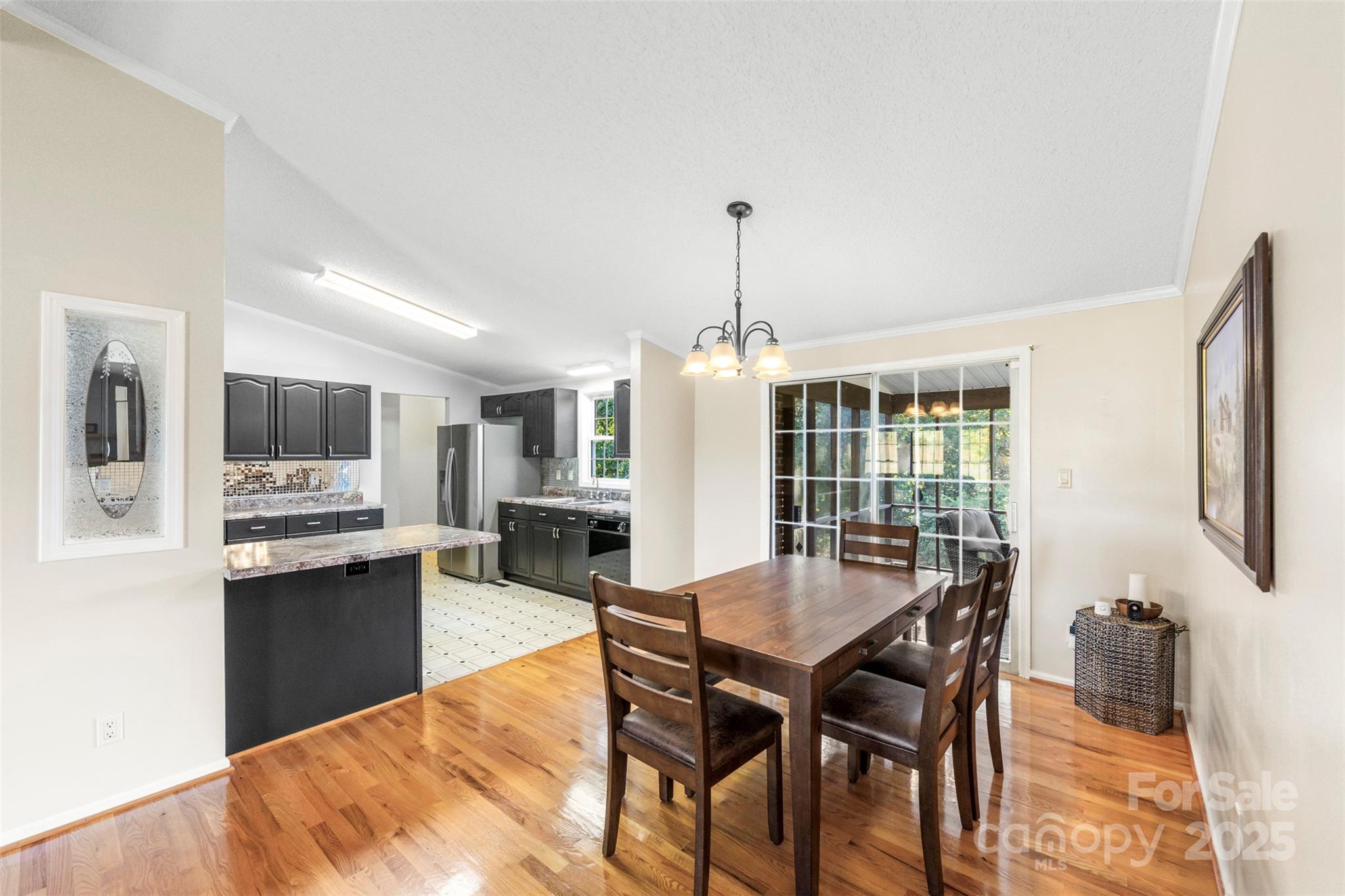 320 Huffstetler Lake Road Dallas, NC 28034 - Photo 11 of 47 a view of a dining room with furniture and a floor to ceiling window