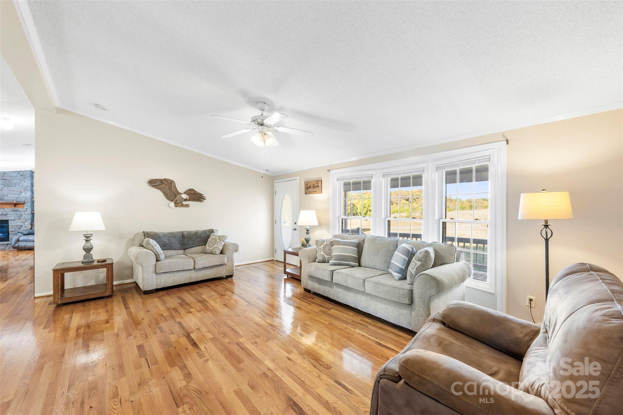 320 Huffstetler Lake Road Dallas, NC 28034 - Photo 12 of 47 a living room with furniture and a wooden floor