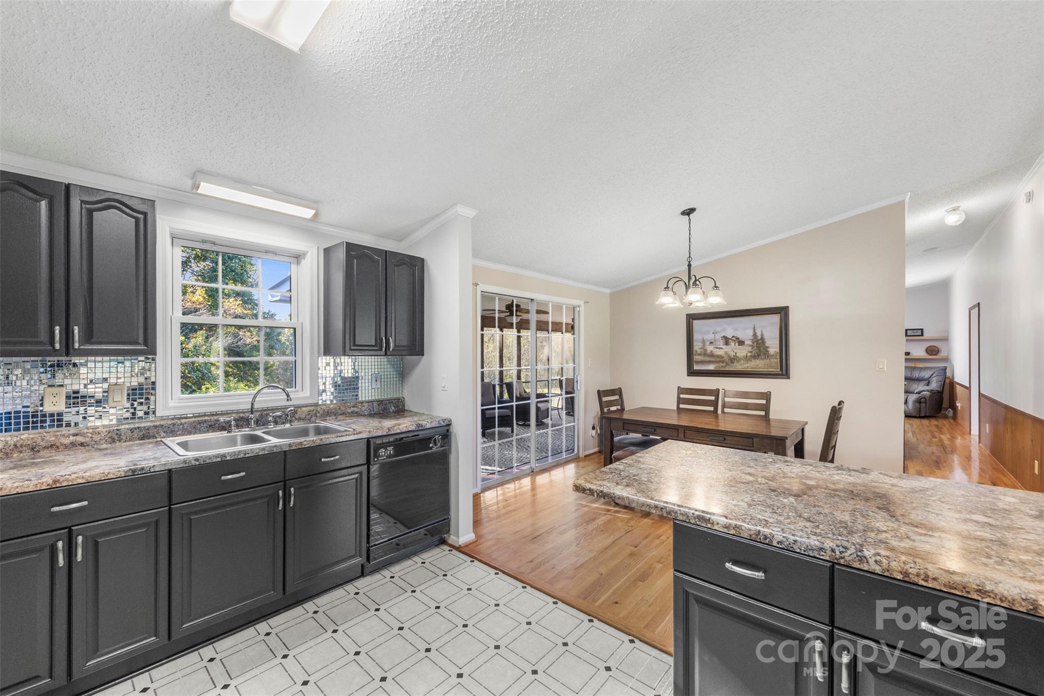 320 Huffstetler Lake Road Dallas, NC 28034 - Photo 13 of 47 a large kitchen with kitchen island a sink stainless steel appliances and cabinets