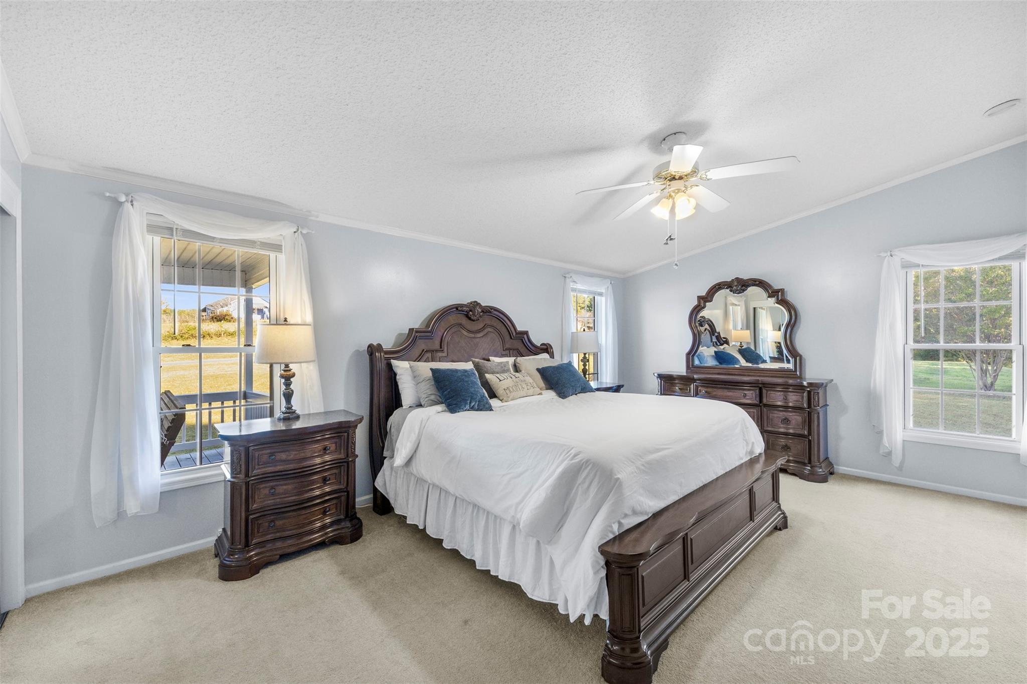 320 Huffstetler Lake Road Dallas, NC 28034 - Photo 16 of 47 a bedroom with a bed dresser and a window