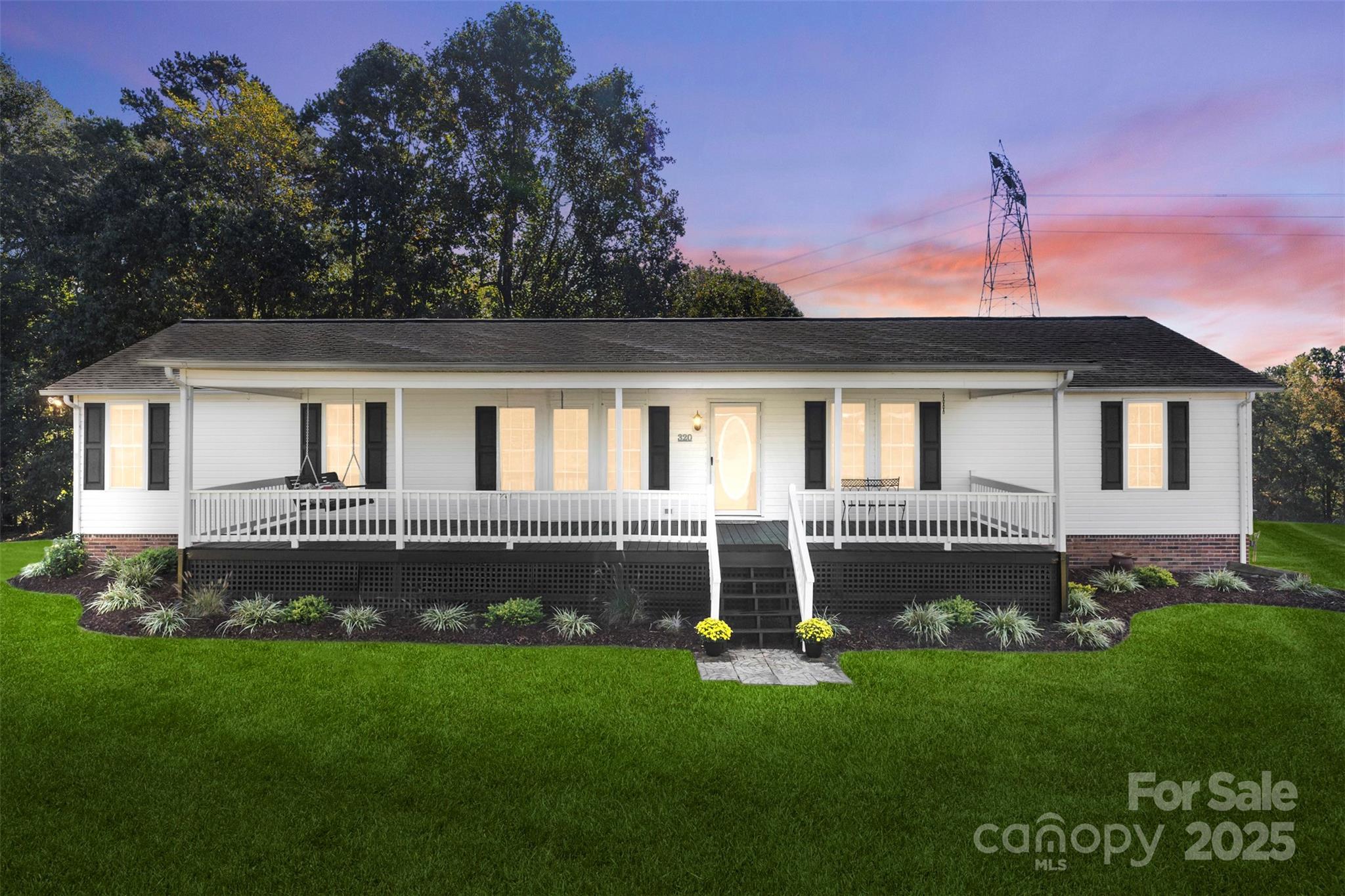 320 Huffstetler Lake Road Dallas, NC 28034 - Photo 2 of 47 a front view of a house with a garden