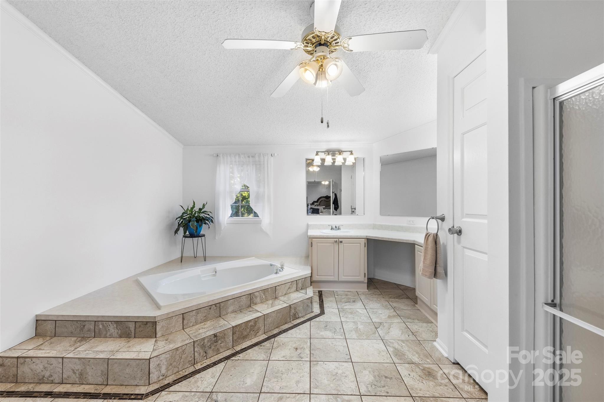 320 Huffstetler Lake Road Dallas, NC 28034 - Photo 22 of 47 a bathroom with a tub sink and mirror