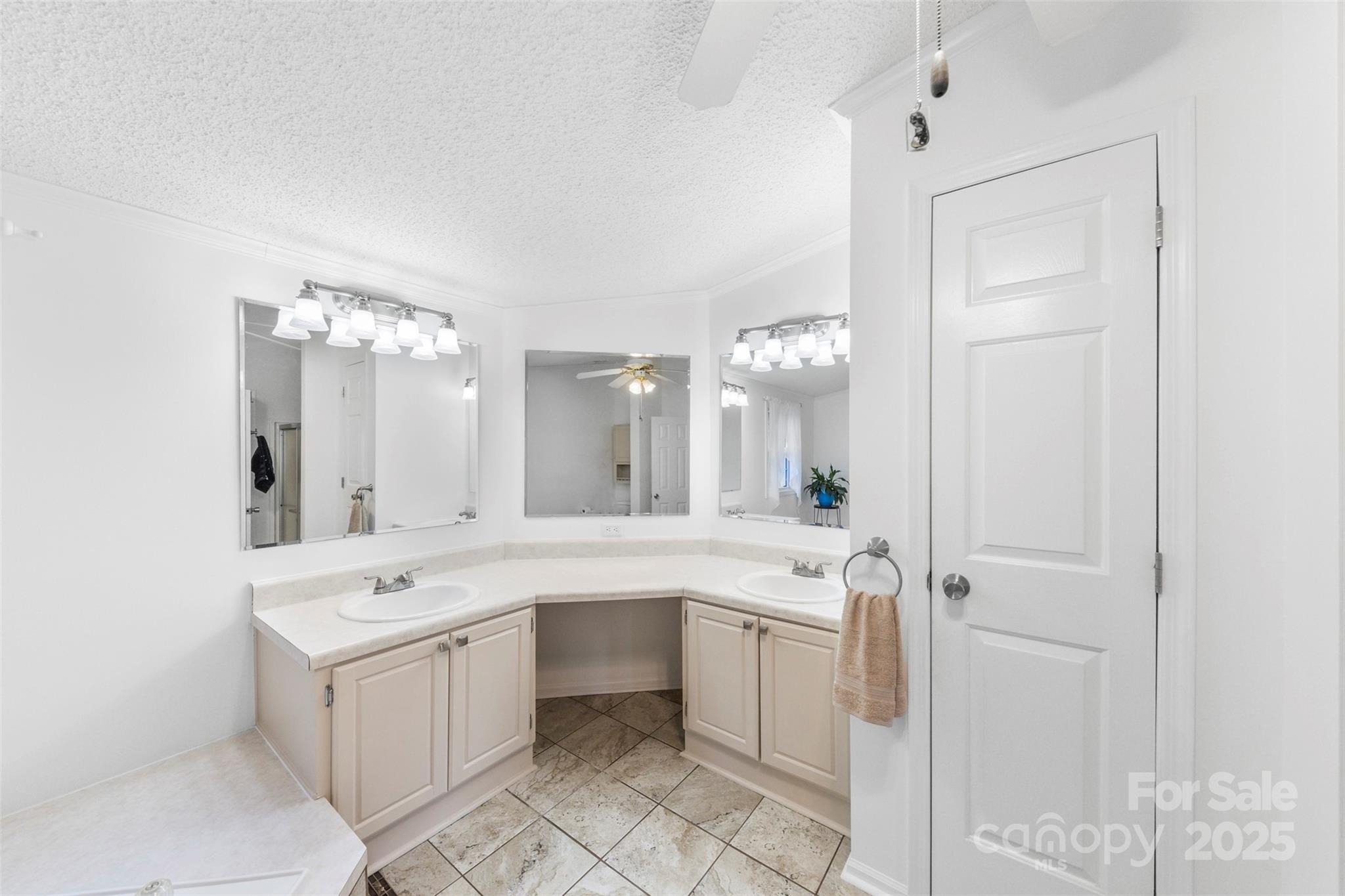320 Huffstetler Lake Road Dallas, NC 28034 - Photo 23 of 47 a large white bathroom with a sink mirror and a bathtub