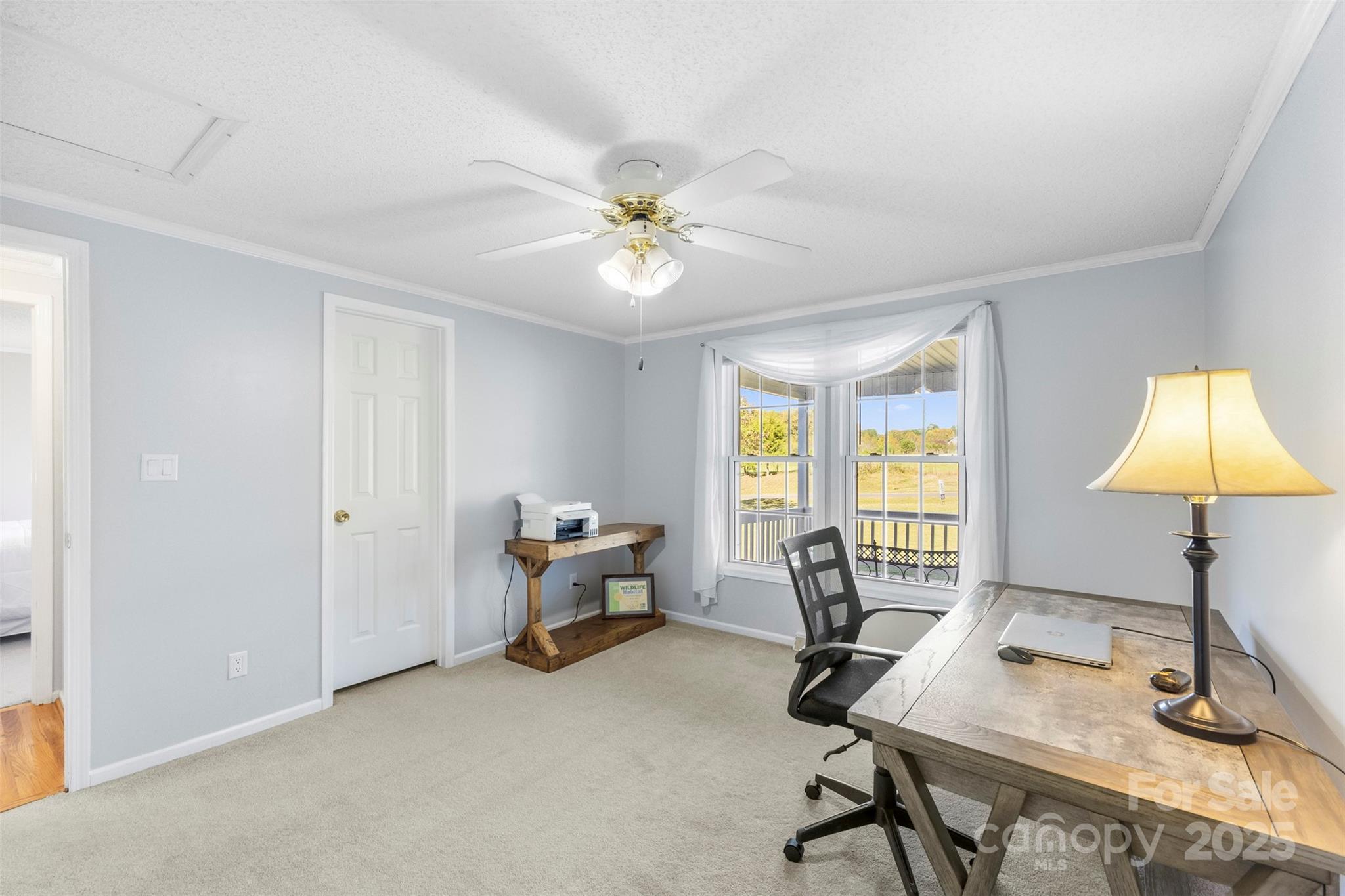 320 Huffstetler Lake Road Dallas, NC 28034 - Photo 27 of 47 a view of a workspace with furniture and a window