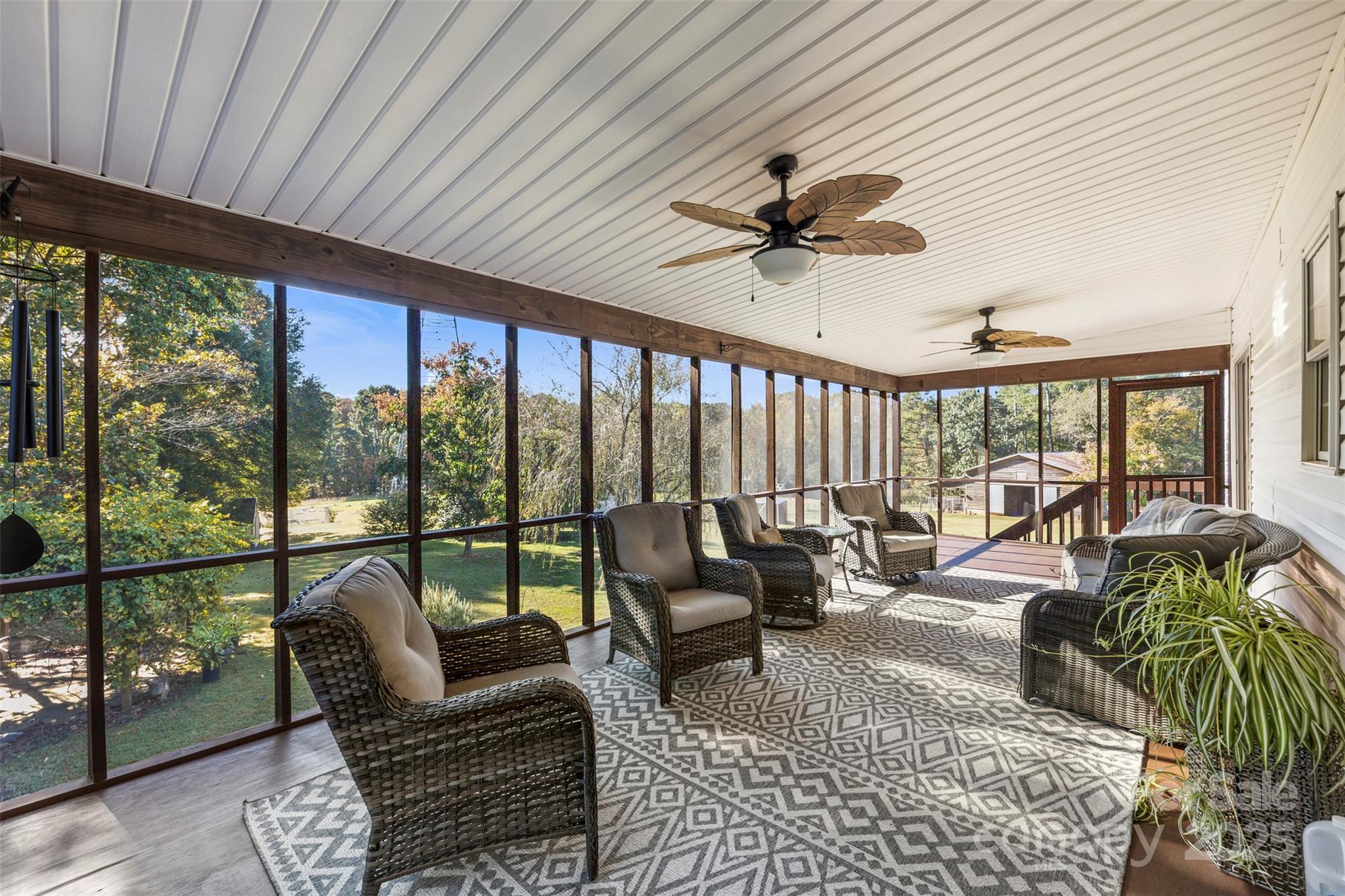 320 Huffstetler Lake Road Dallas, NC 28034 - Photo 4 of 47 a living room with furniture floor to ceiling window and a table