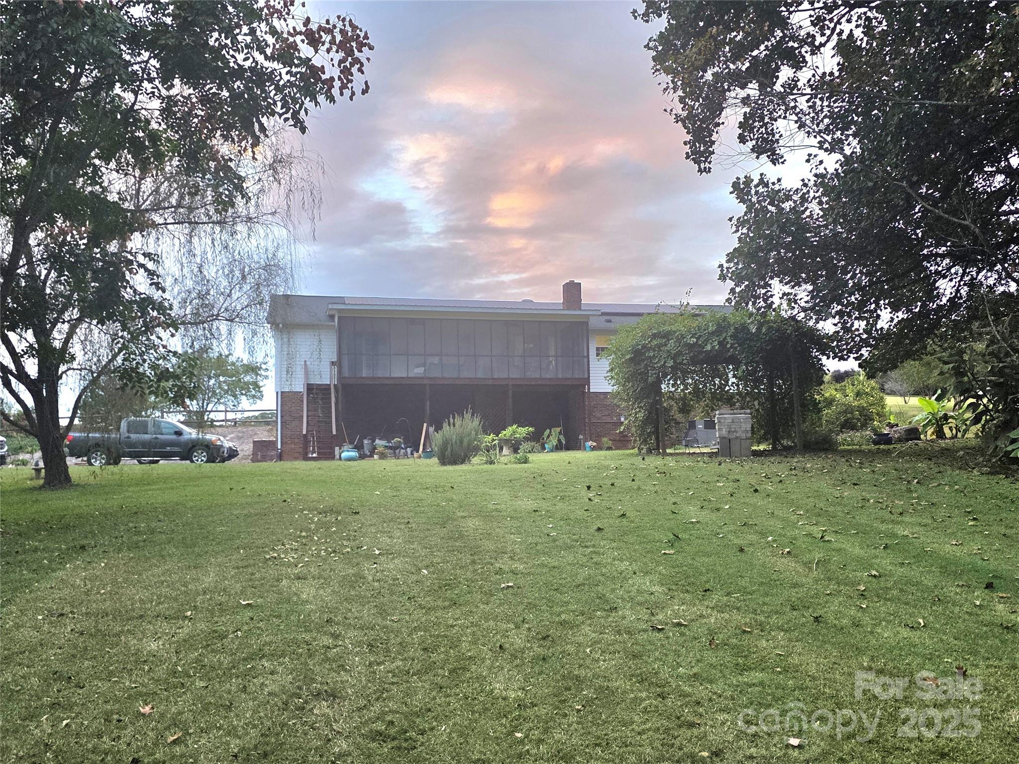 320 Huffstetler Lake Road Dallas, NC 28034 - Photo 42 of 47 a view of a backyard with large trees