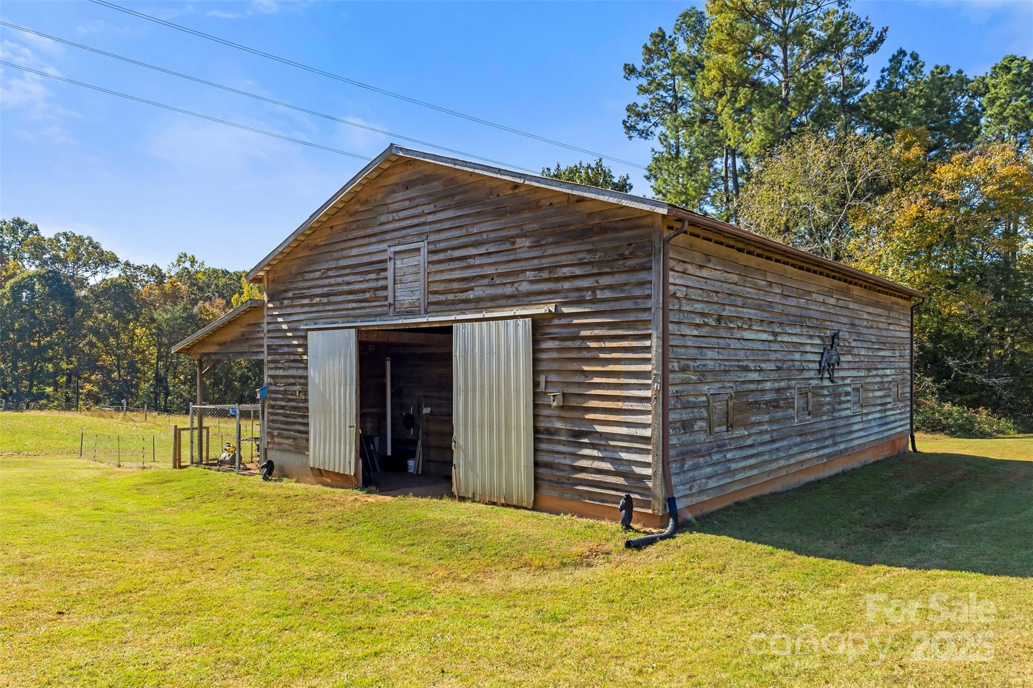 320 Huffstetler Lake Road Dallas, NC 28034 - Photo 47 of 47 a view of a house with a backyard and a tree