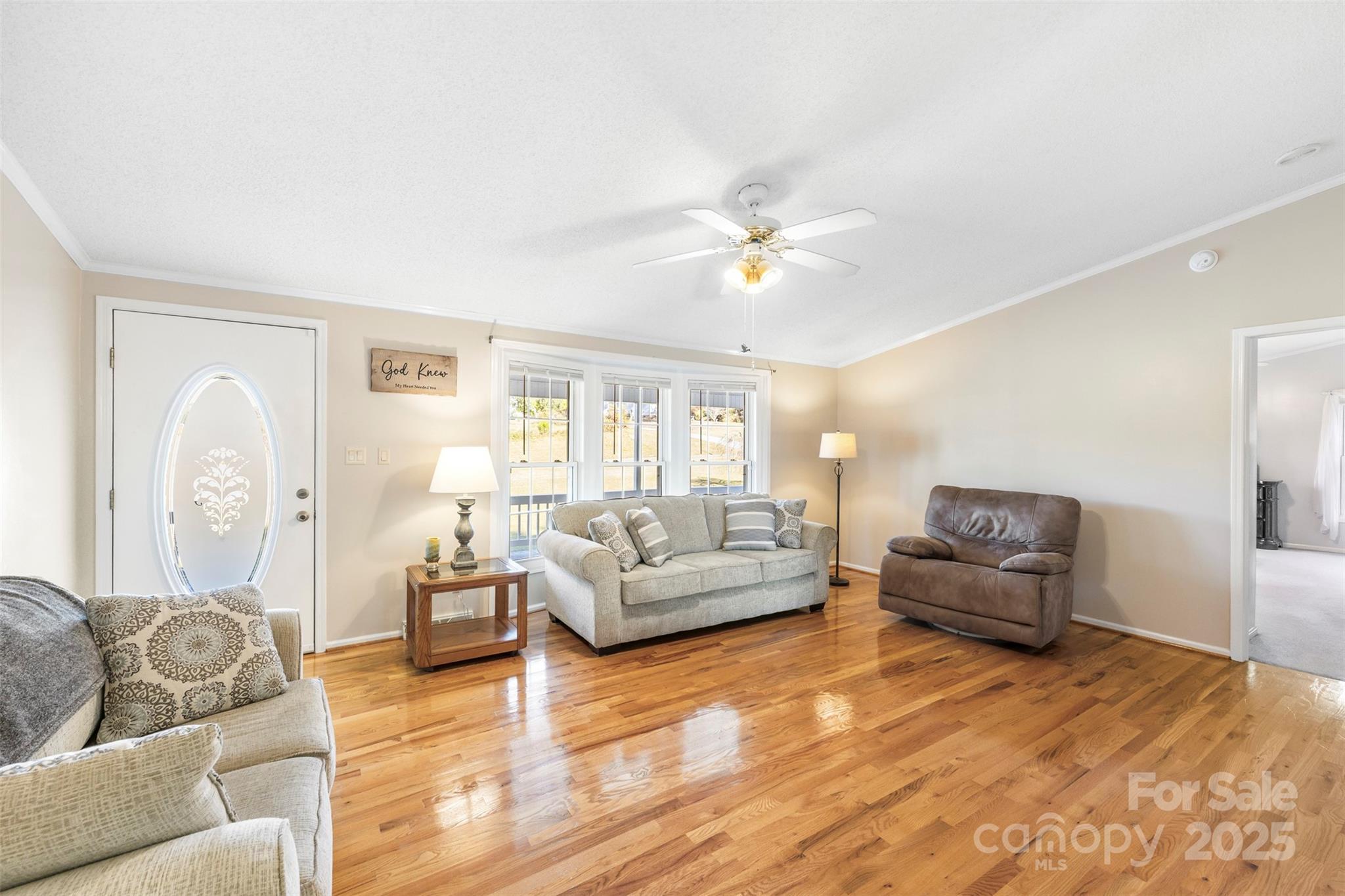 320 Huffstetler Lake Road Dallas, NC 28034 - Photo 8 of 47 a living room with furniture and a wooden floor