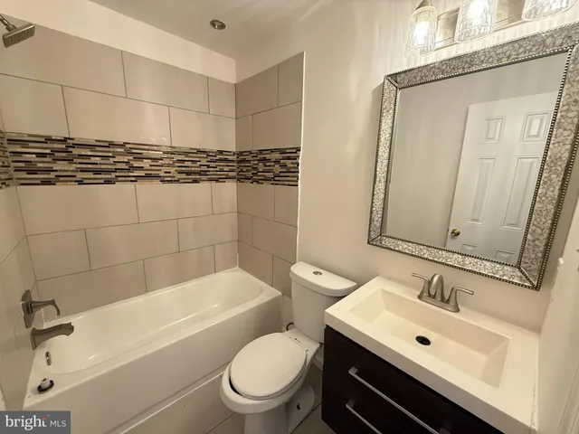 a bathroom with a bathtub and shower