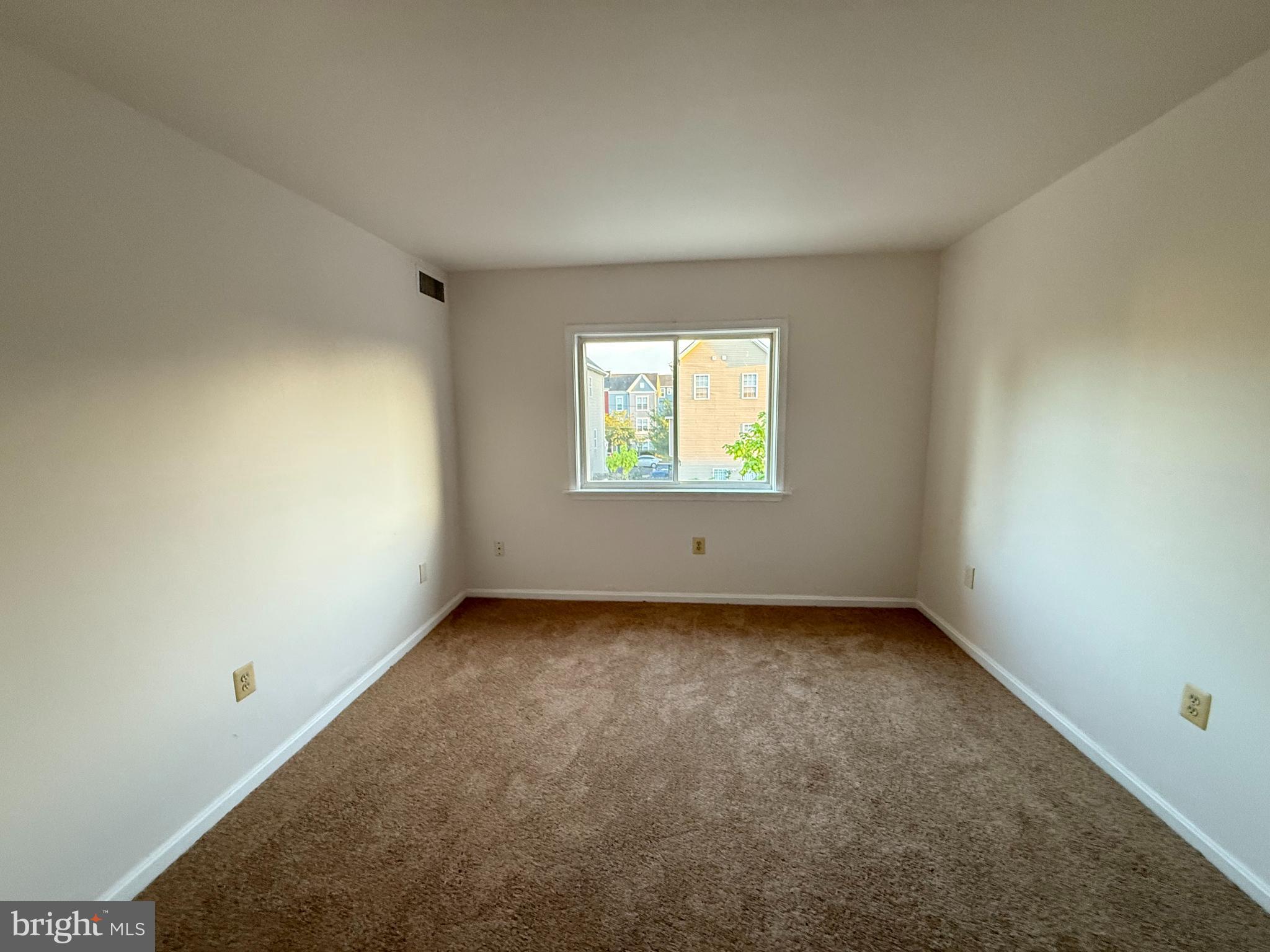 5009 D Street Southeast, Unit 303 Washington, DC 20019 - Photo 18 of 25 an empty room with a window