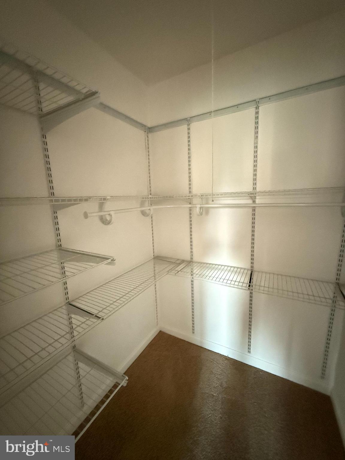 5009 D Street Southeast, Unit 303 Washington, DC 20019 - Photo 19 of 25 a empty room with wooden floor