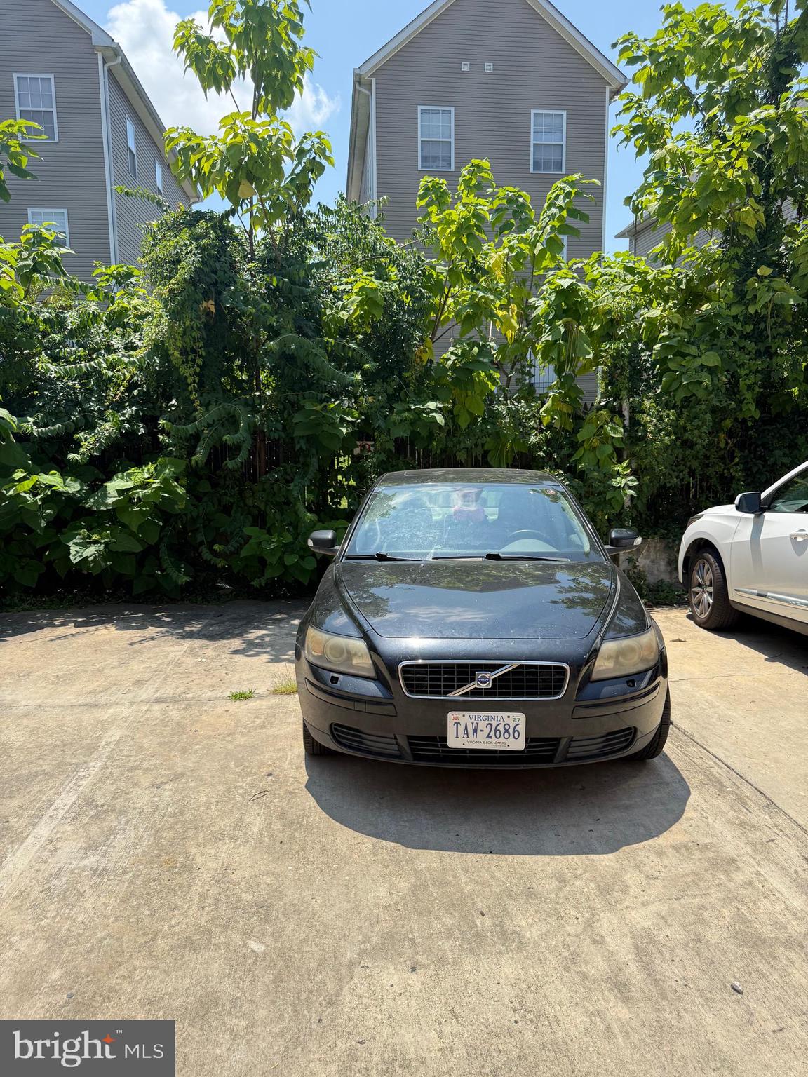 5009 D Street Southeast, Unit 303 Washington, DC 20019 - Photo 22 of 25 a car parked in front of a house