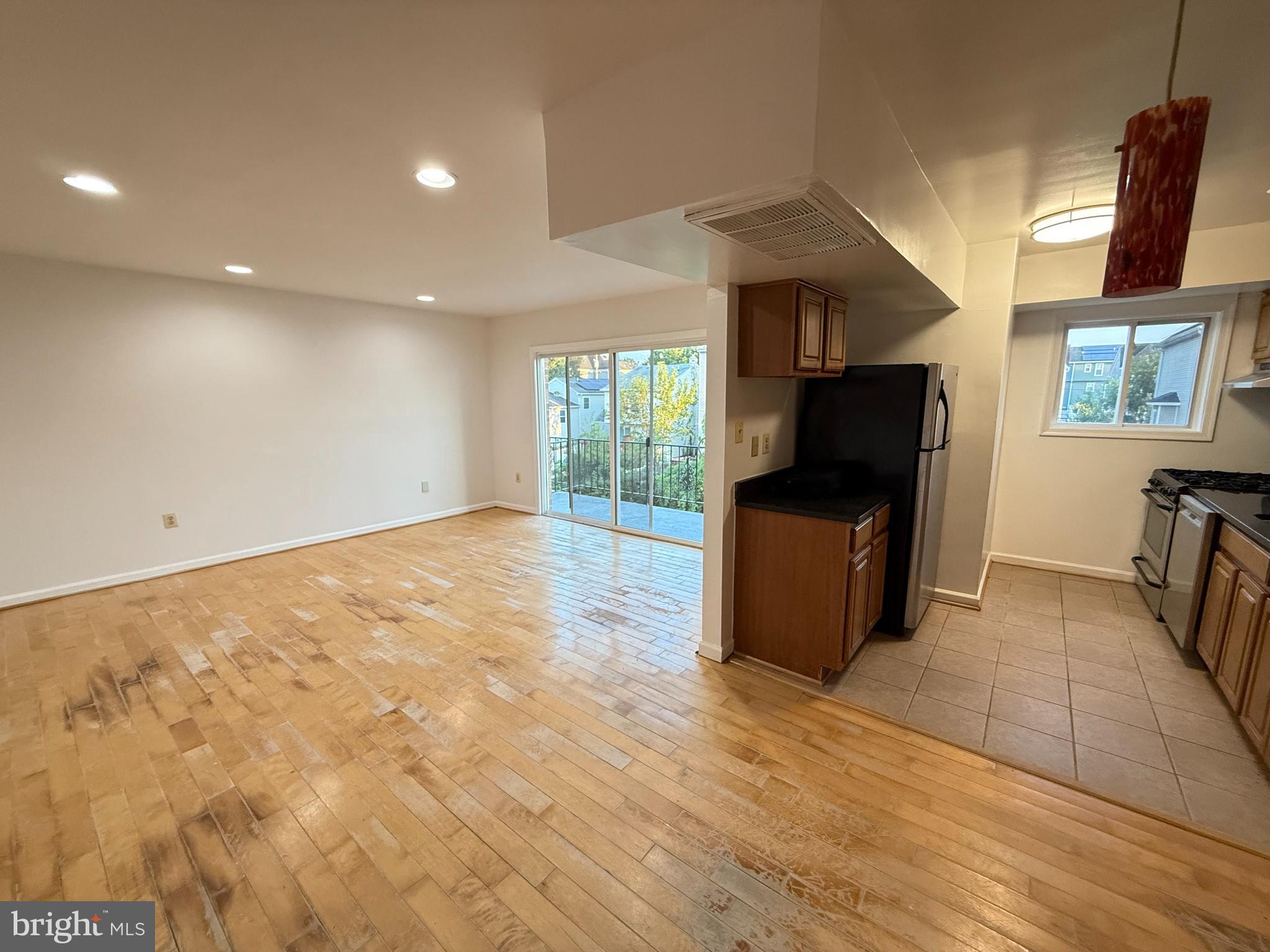 5009 D Street Southeast, Unit 303 Washington, DC 20019 - Photo 3 of 25 a view of a livingroom with furniture and a flat screen tv