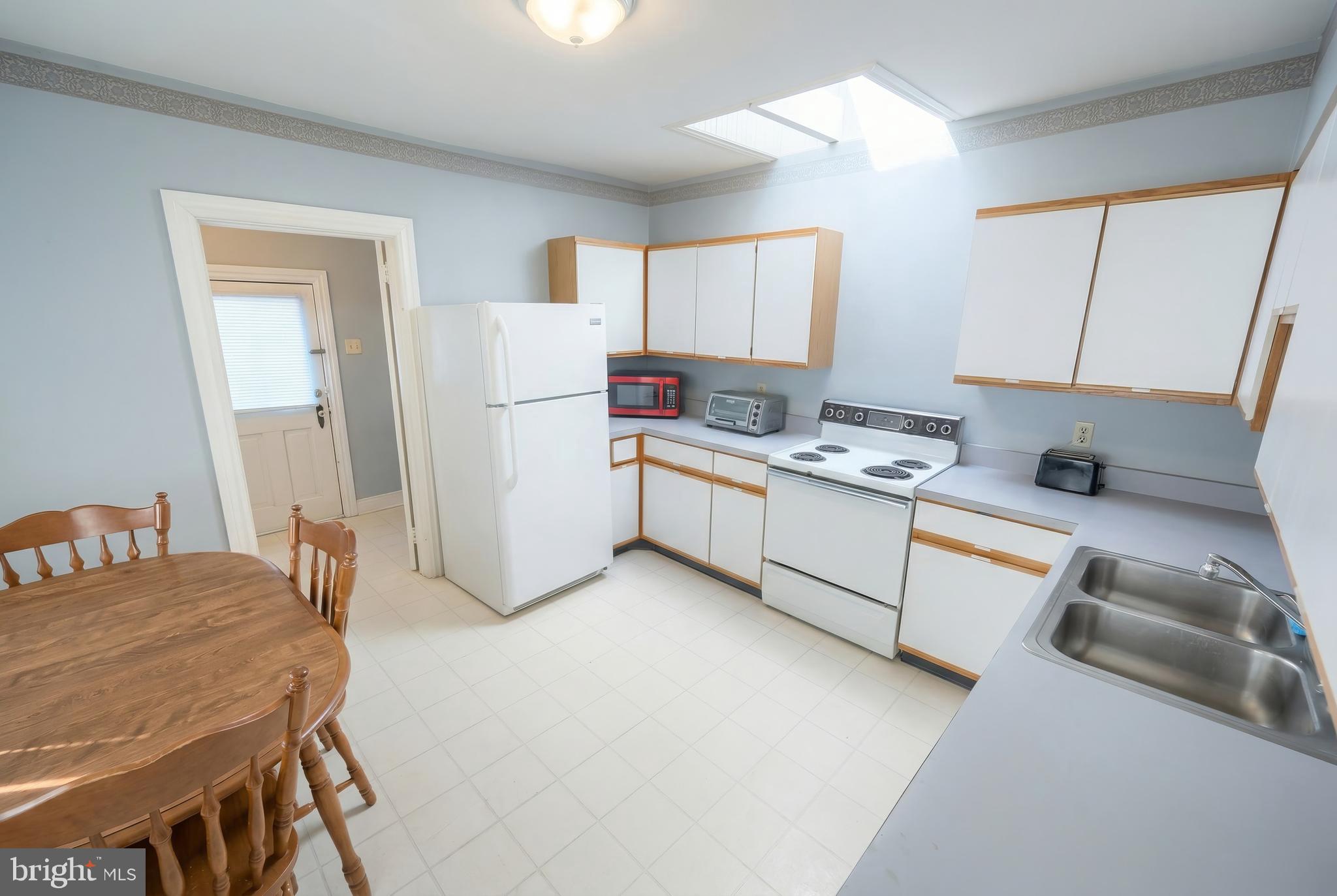 117 Baltimore Street Hanover, PA 17331 - Photo 11 of 37 a kitchen that has a sink and a table in it