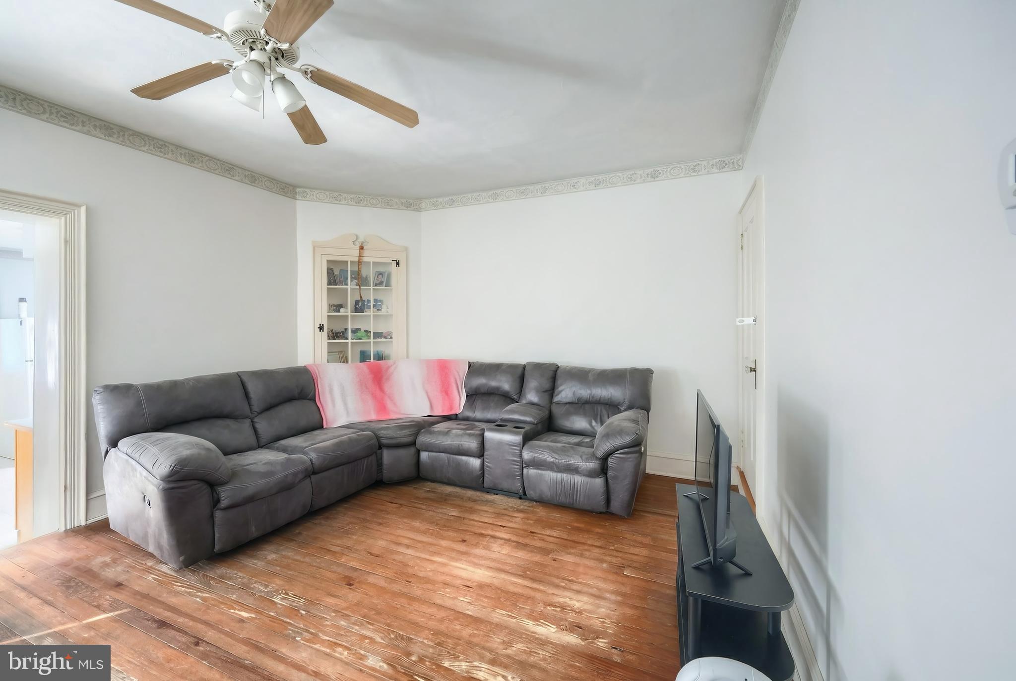 117 Baltimore Street Hanover, PA 17331 - Photo 17 of 37 a living room with furniture and a rug