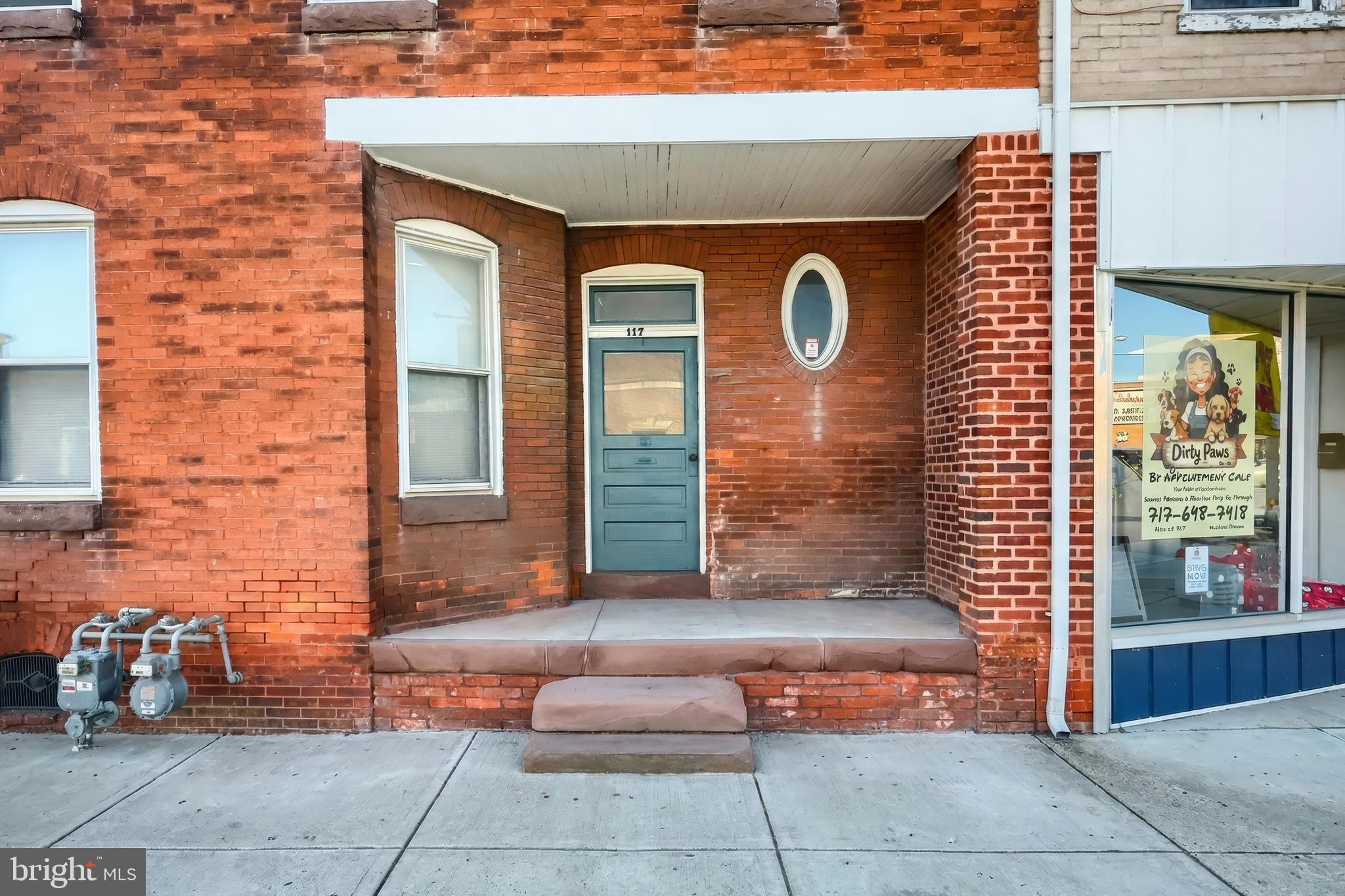 117 Baltimore Street Hanover, PA 17331 - Photo 2 of 37 a front view of a house with outdoor seating