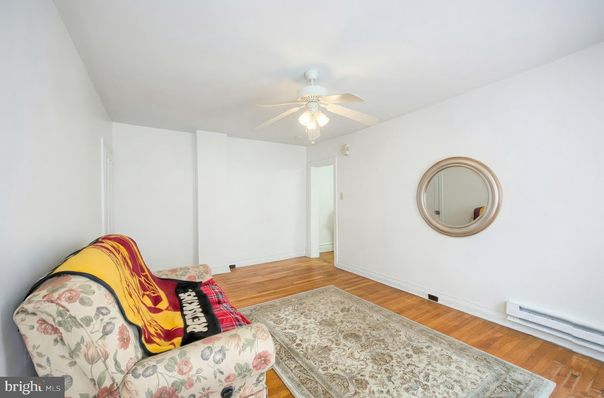 117 Baltimore Street Hanover, PA 17331 - Photo 23 of 37 a bedroom with a bed and a chandelier