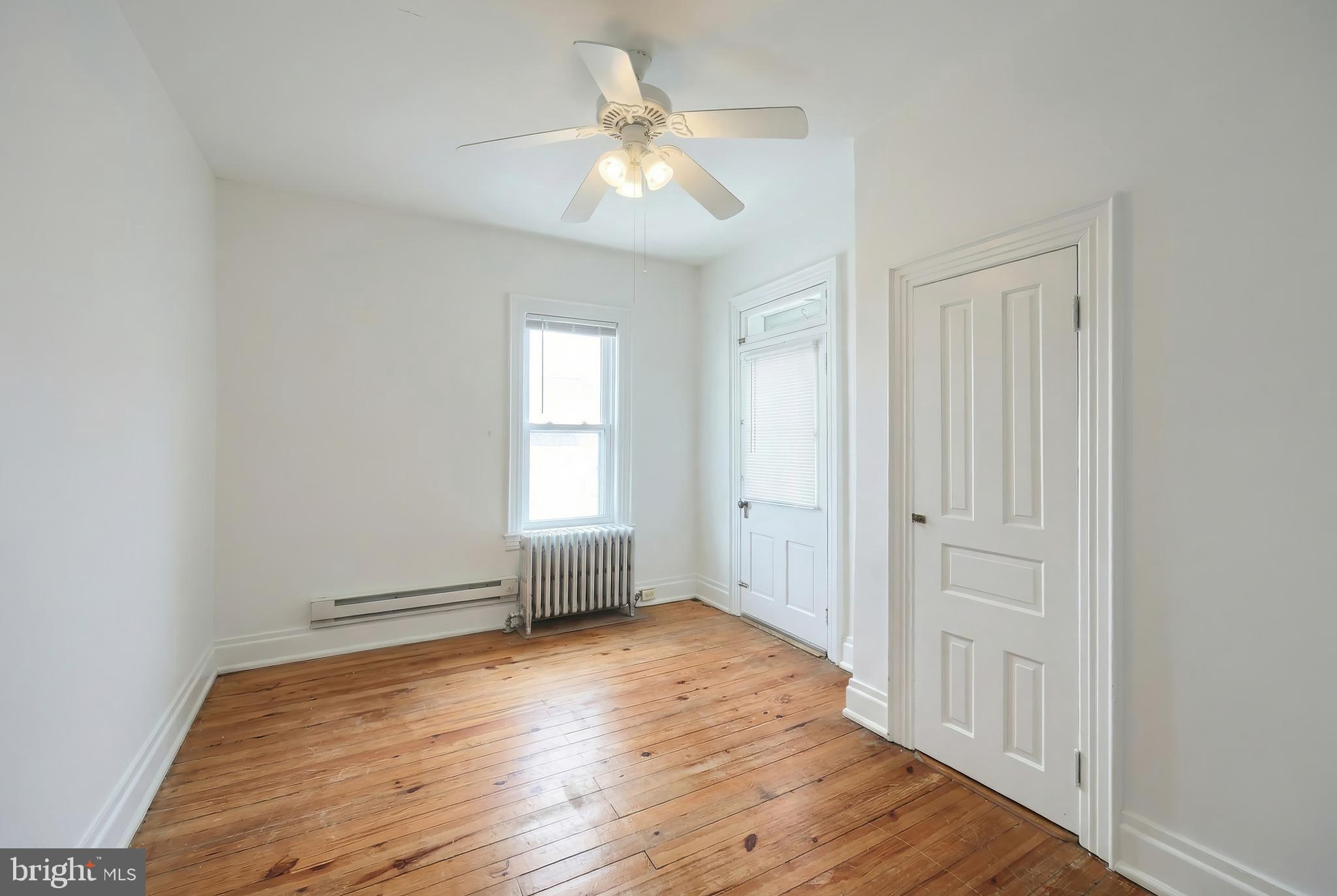 117 Baltimore Street Hanover, PA 17331 - Photo 30 of 37 a view of empty room with wooden floor and fan