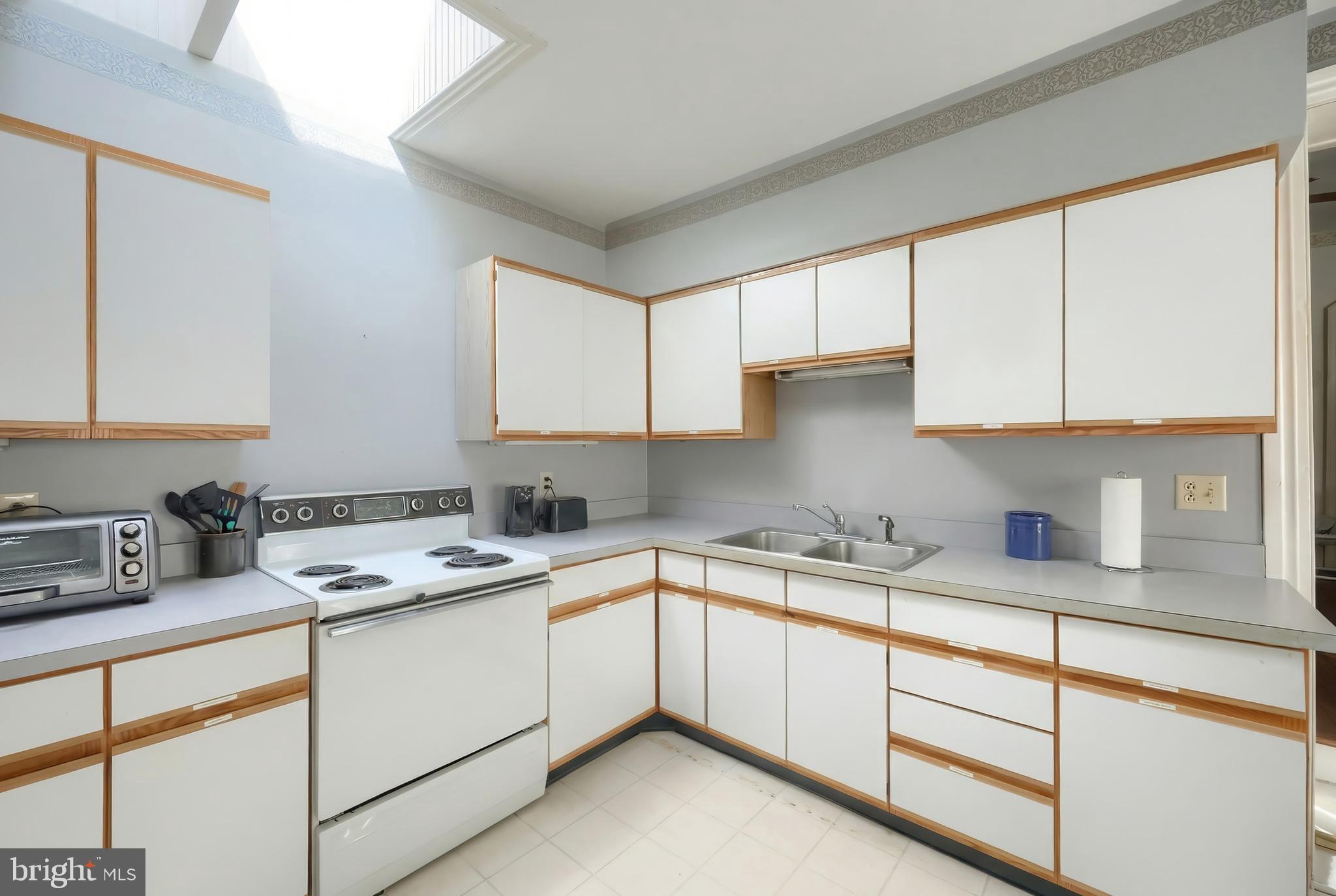 117 Baltimore Street Hanover, PA 17331 - Photo 10 of 37 a kitchen with a sink stove and cabinets