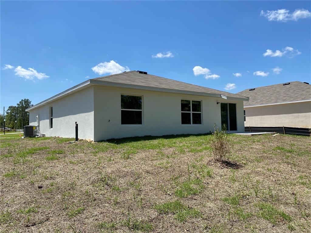492 Hickory Course Loop Ocala, FL 34472 - Photo 27 of 28 a view of a backyard