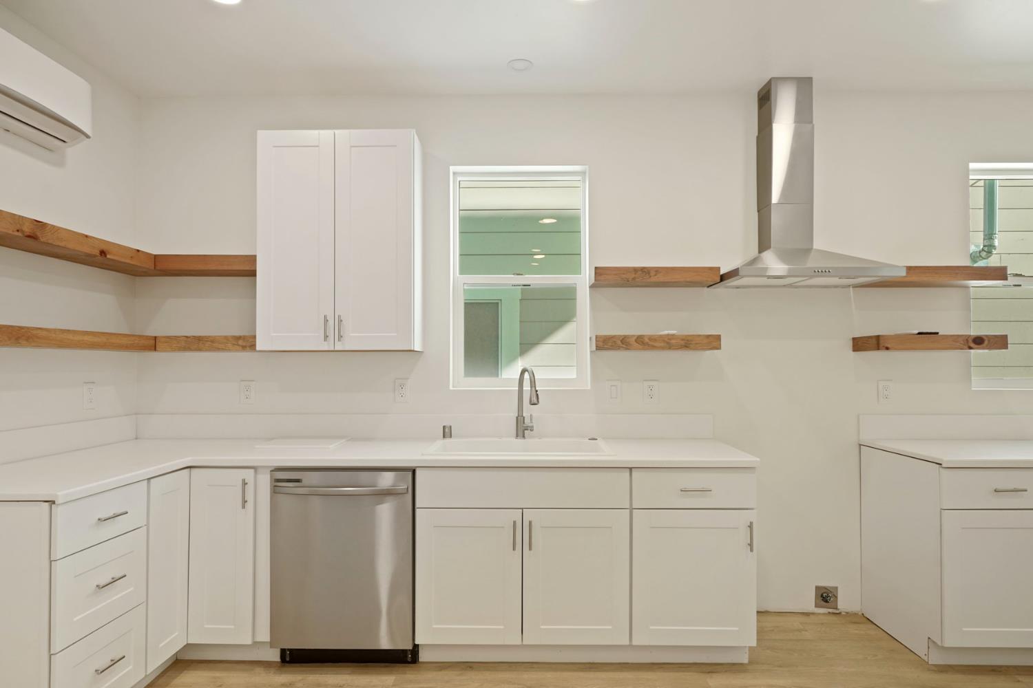 1269 B Street Walnut Grove, CA 95690 - Photo 12 of 42 a kitchen with white cabinets and sink