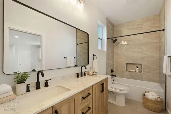 a bathroom with a shower a sink and a mirror