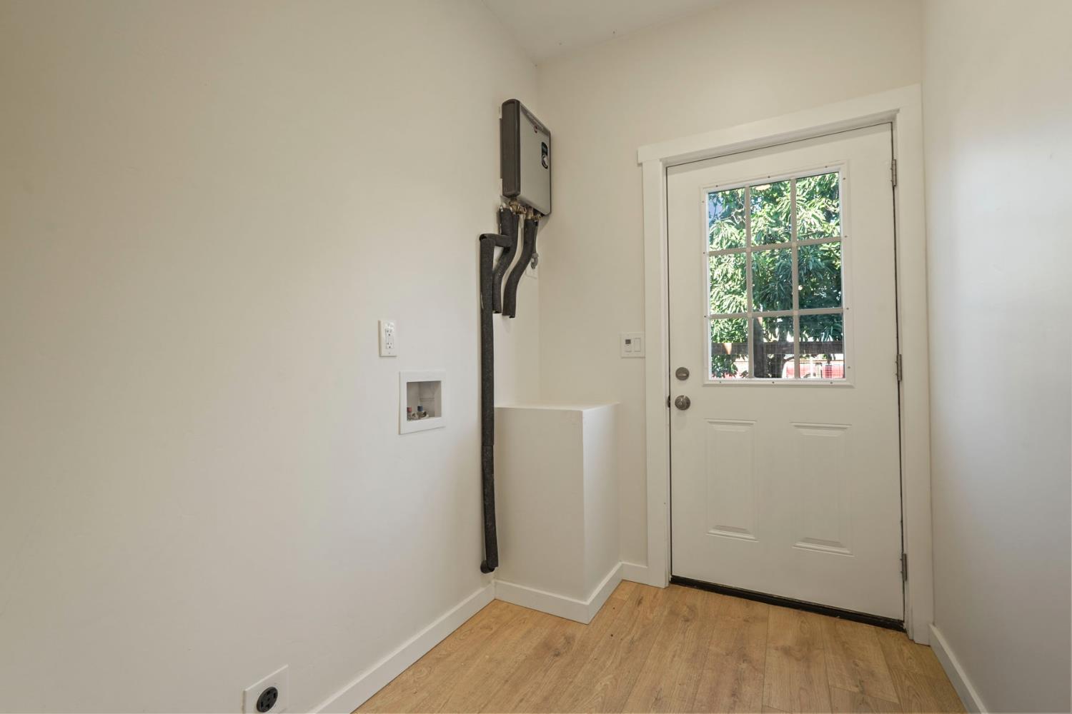 1269 B Street Walnut Grove, CA 95690 - Photo 20 of 42 a view of empty room with wooden floor and fan