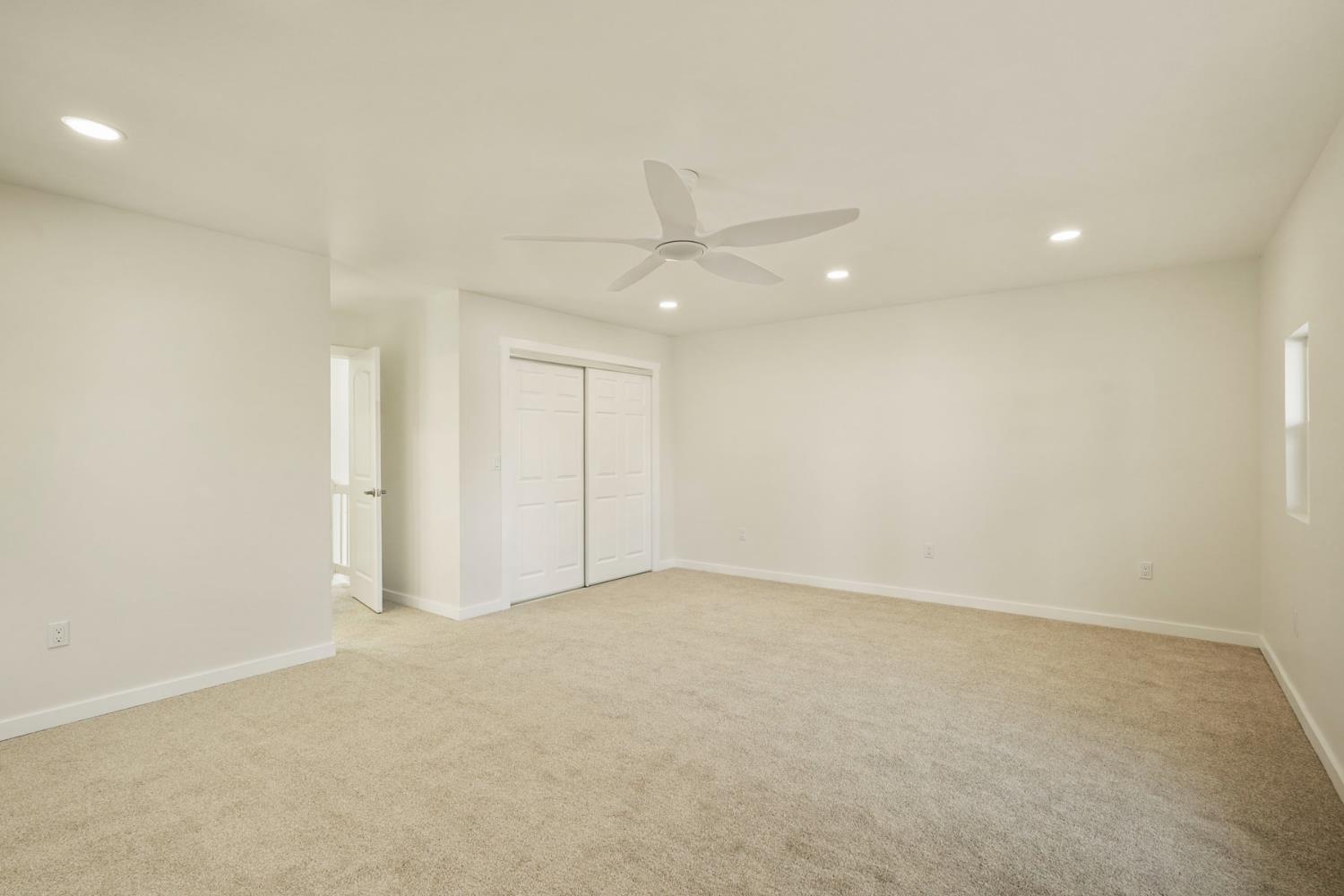 1269 B Street Walnut Grove, CA 95690 - Photo 29 of 42 an empty room with a ceiling fan and a window